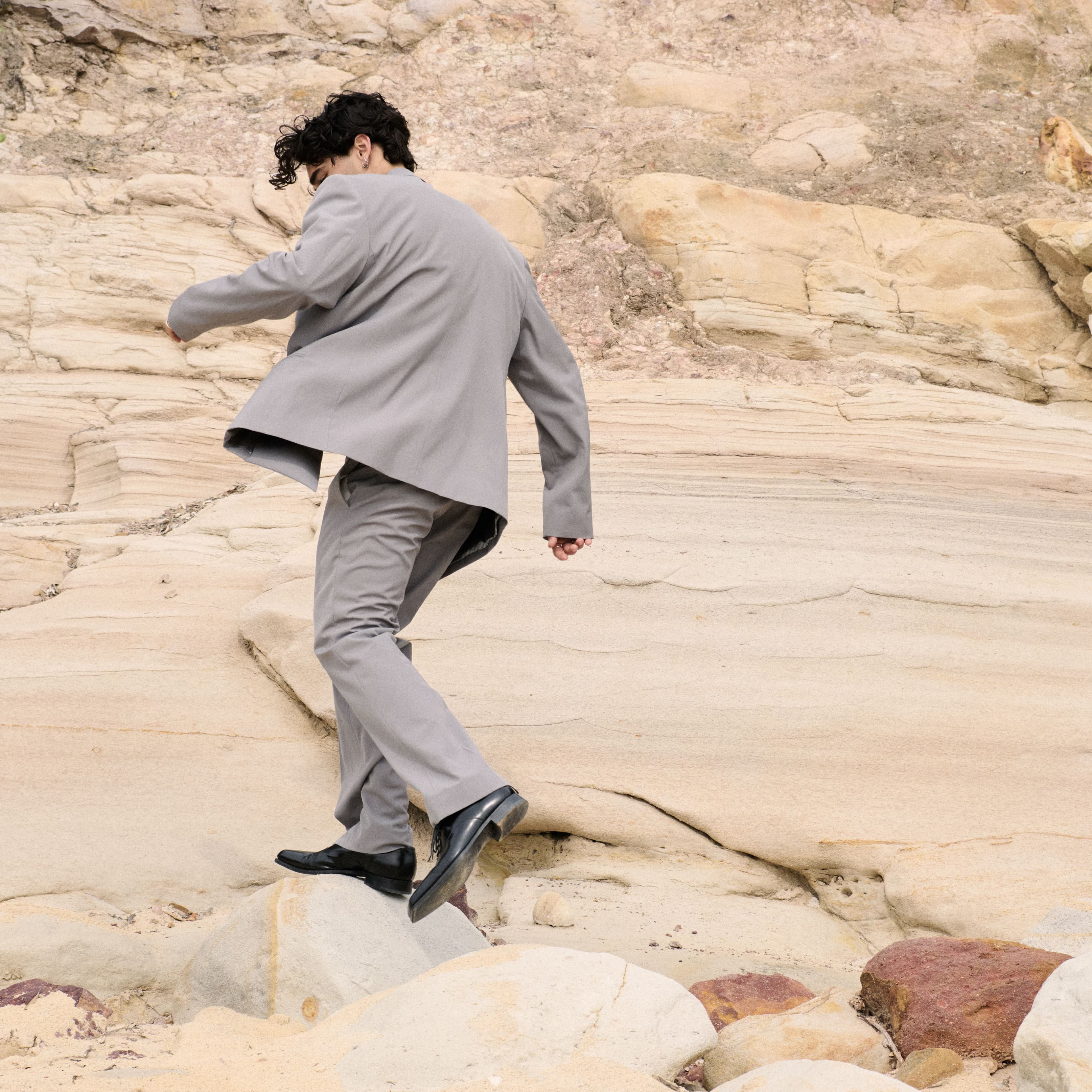 SUIT by ,Acne Studios. ,SHOES by ,Prada.