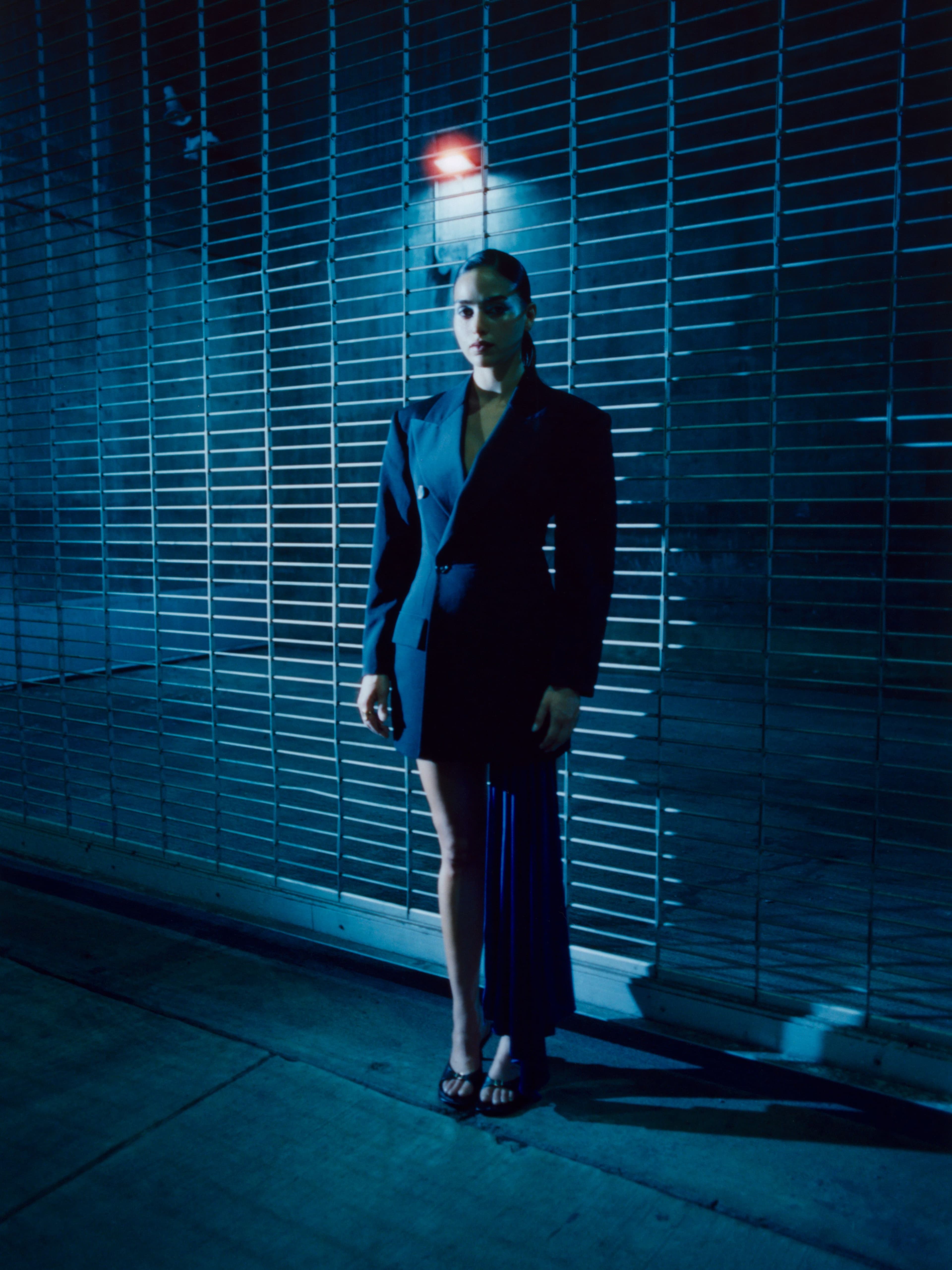 JACKET by Stella McCartney. SKIRT by The Andamane. SHOES by Simkhai.