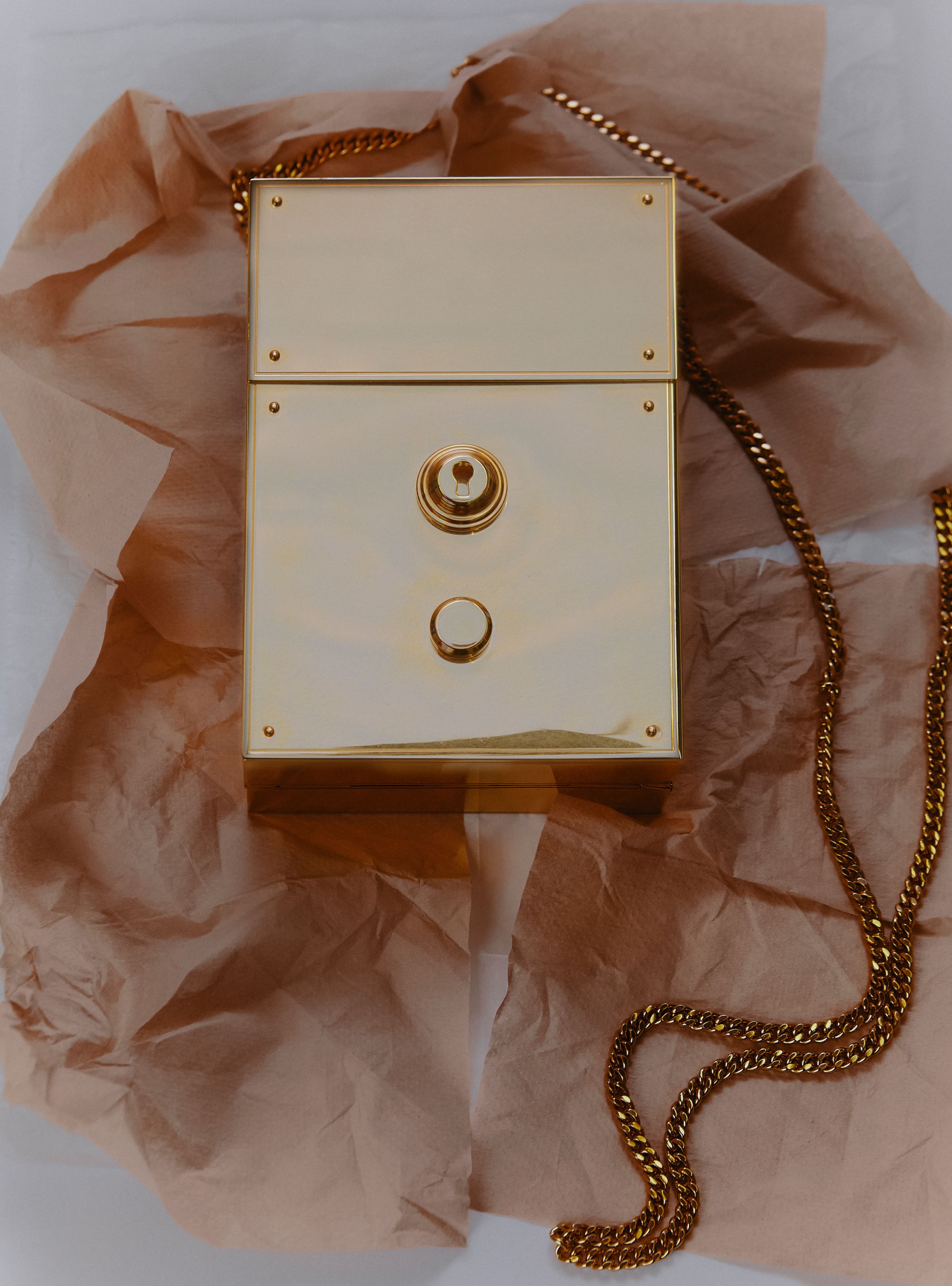 Originating in the West Village and deeply rooted in New York, Thom Browne’s eponymous label epitomizes the imagination of the city’s fashion scene. This brass bag plays upon proportions with reference to the brand’s signature lock, featured on its Mr. and Mrs. Thom bags.