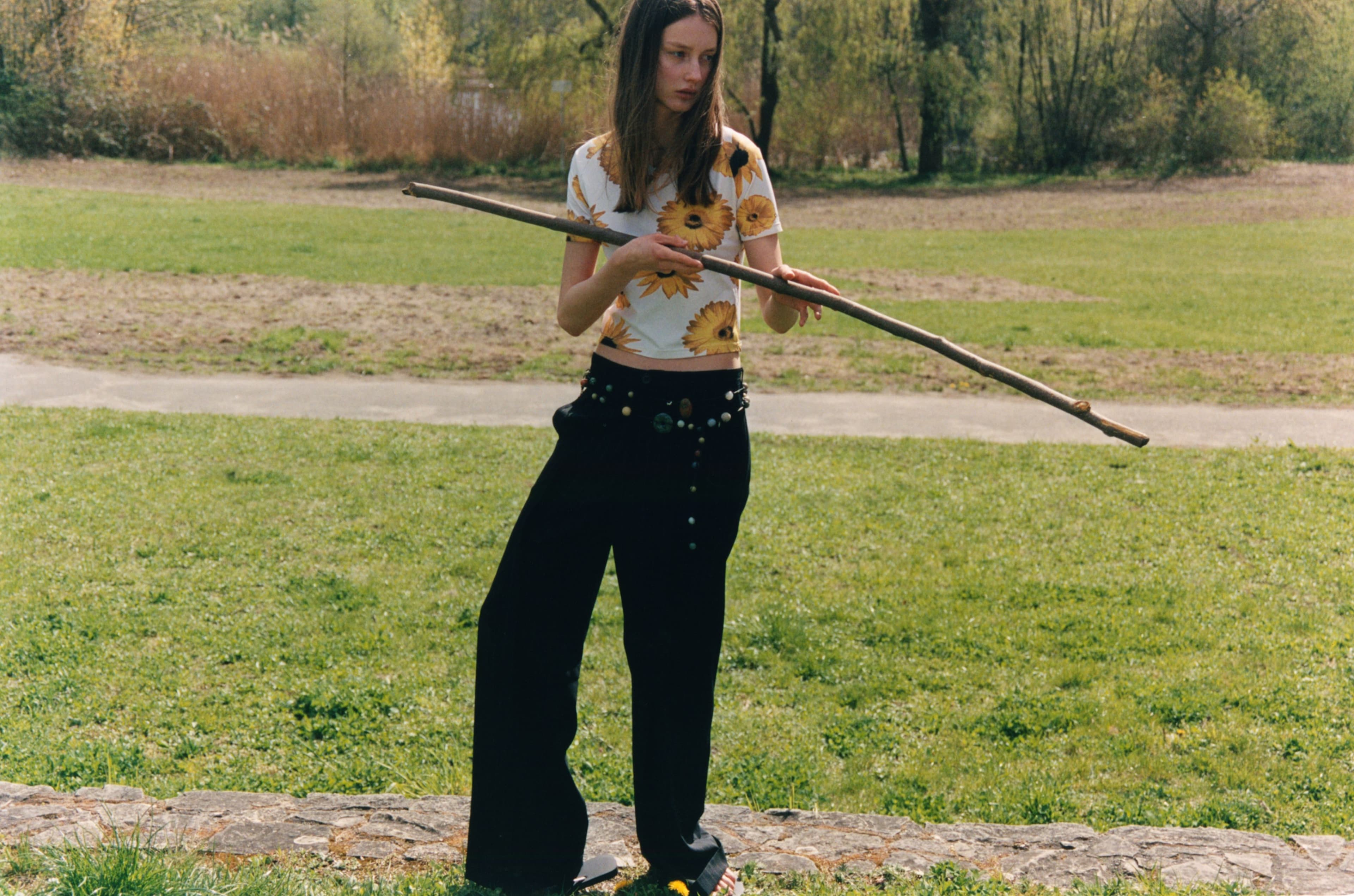 Vintage T-SHIRT by Calvin Klein; vintage PANTS by Yohji Yamamoto; BELTS by PRUM; SANDALS by Havaianas