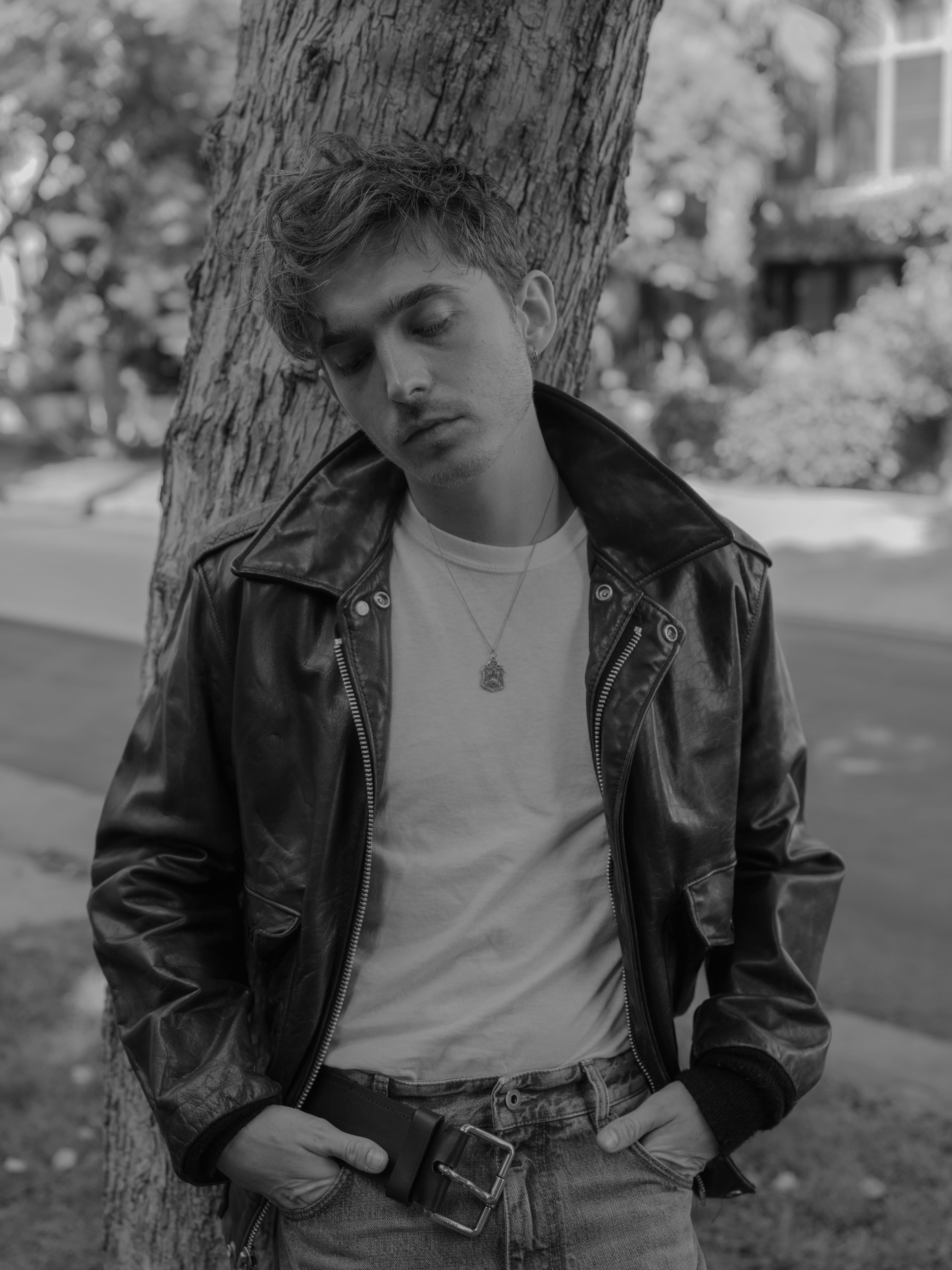 Vintage JACKET by ,Schott,. T-SHIRT and NECKLACE, stylist’s own. PANTS by ,Loewe.