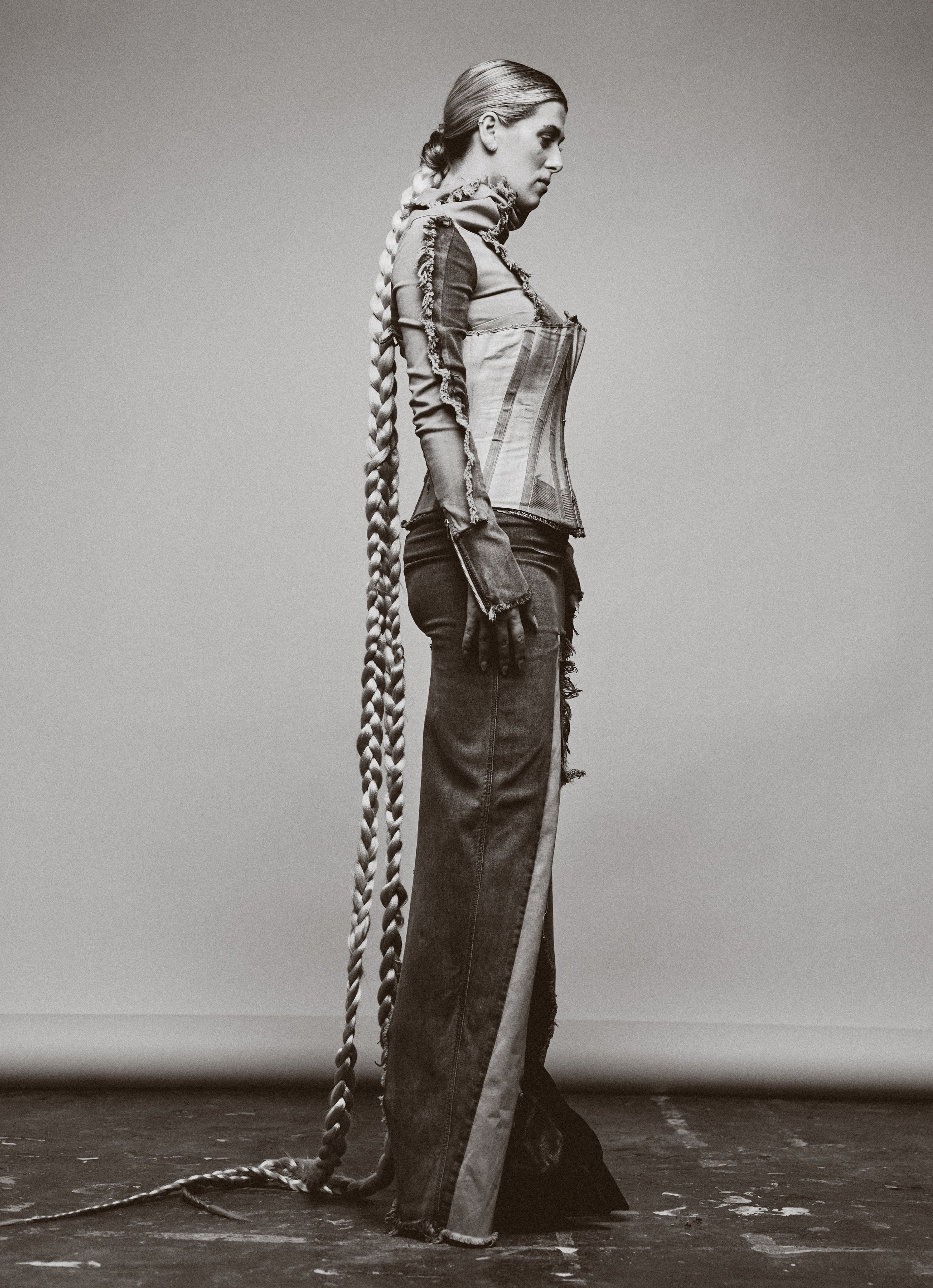 TOP, PANTS, and BOOTS by Rick Owens; CORSET by Rebecca Sweeting; Vintage CORSET from Rellik