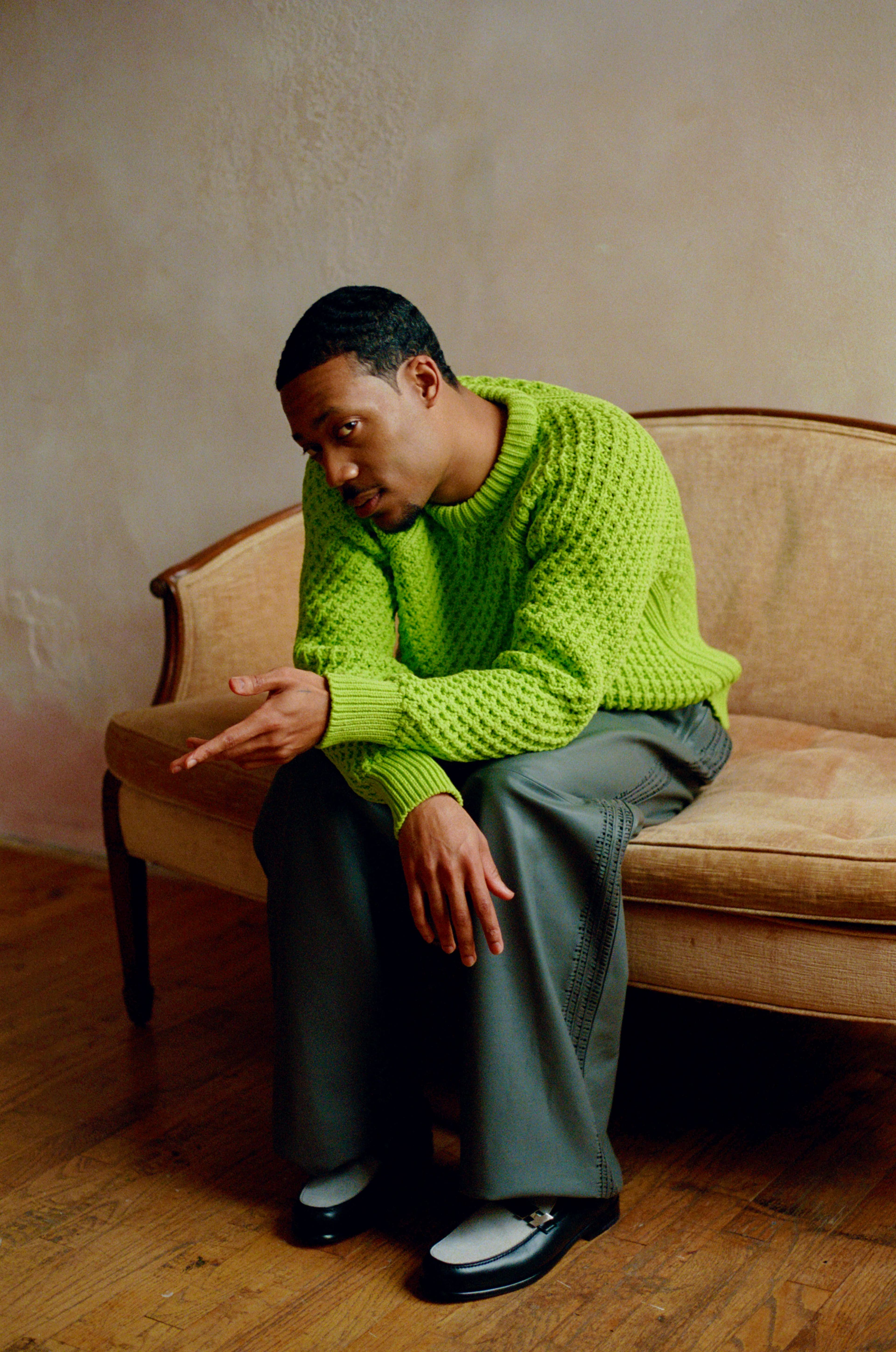 SWEATER by Dior. PANTS and SHOES by Hermès.