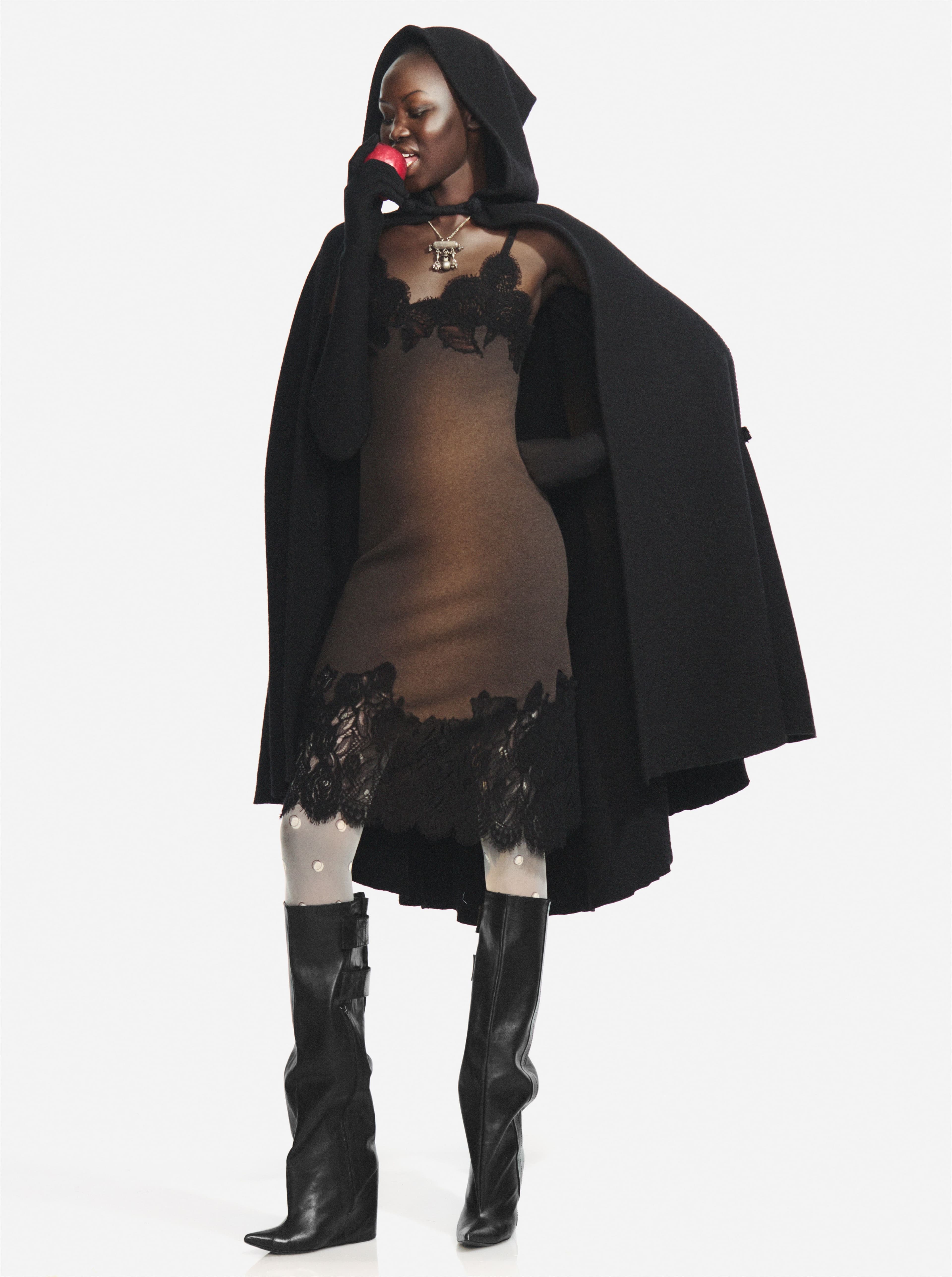 DRESS by ,Burberry., Vintage CAPE from the Albright Fashion Library. TIGHTS by ,Falke., Vintage SHOES by ,Balenciaga, from the Albright Fashion Library. Vintage NECKLACE from David Aliperti Archive.