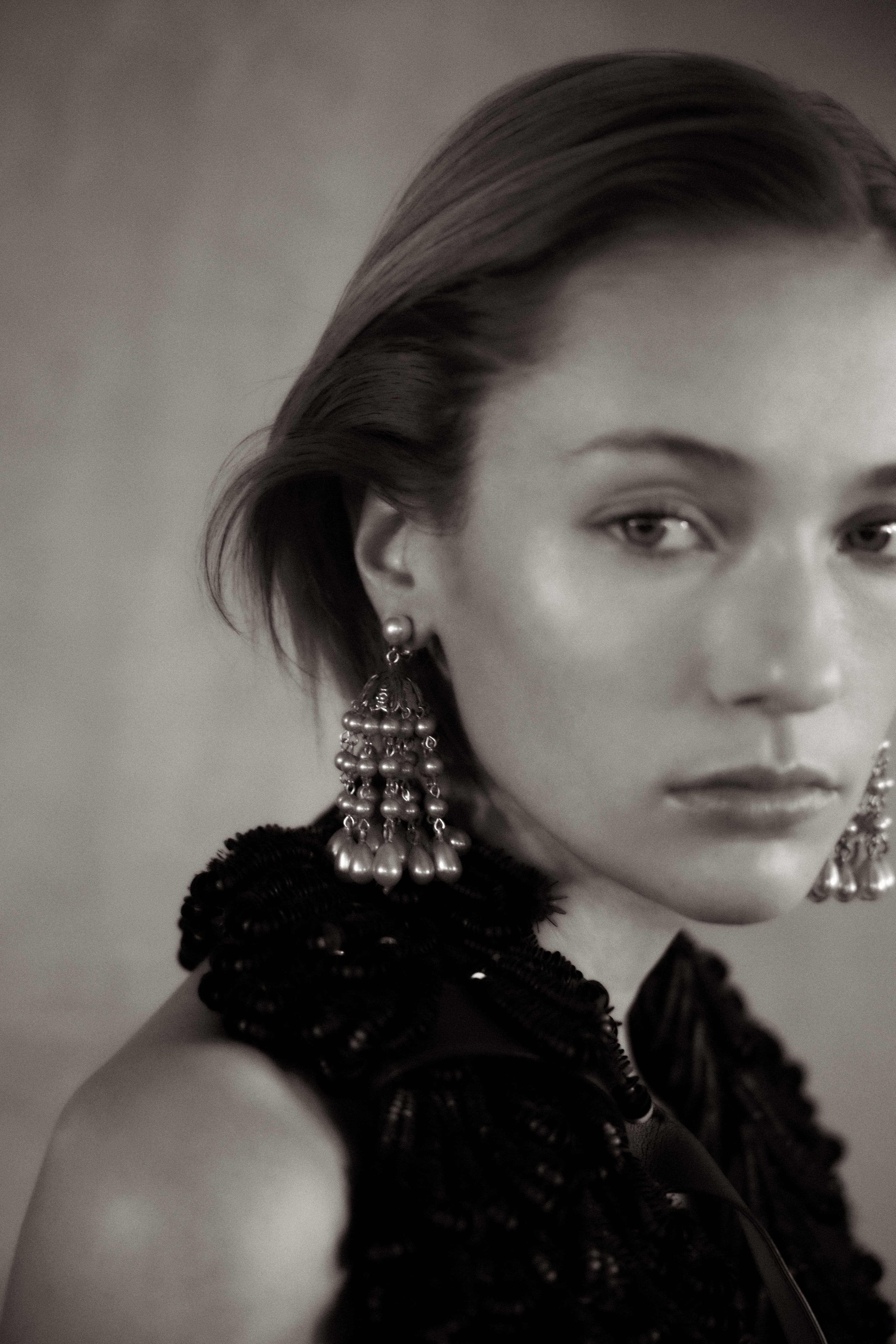 Vintage DRESS by ,Givenchy, from Albright Fashion Library. Vintage EARRINGS by ,Norma Kamali.