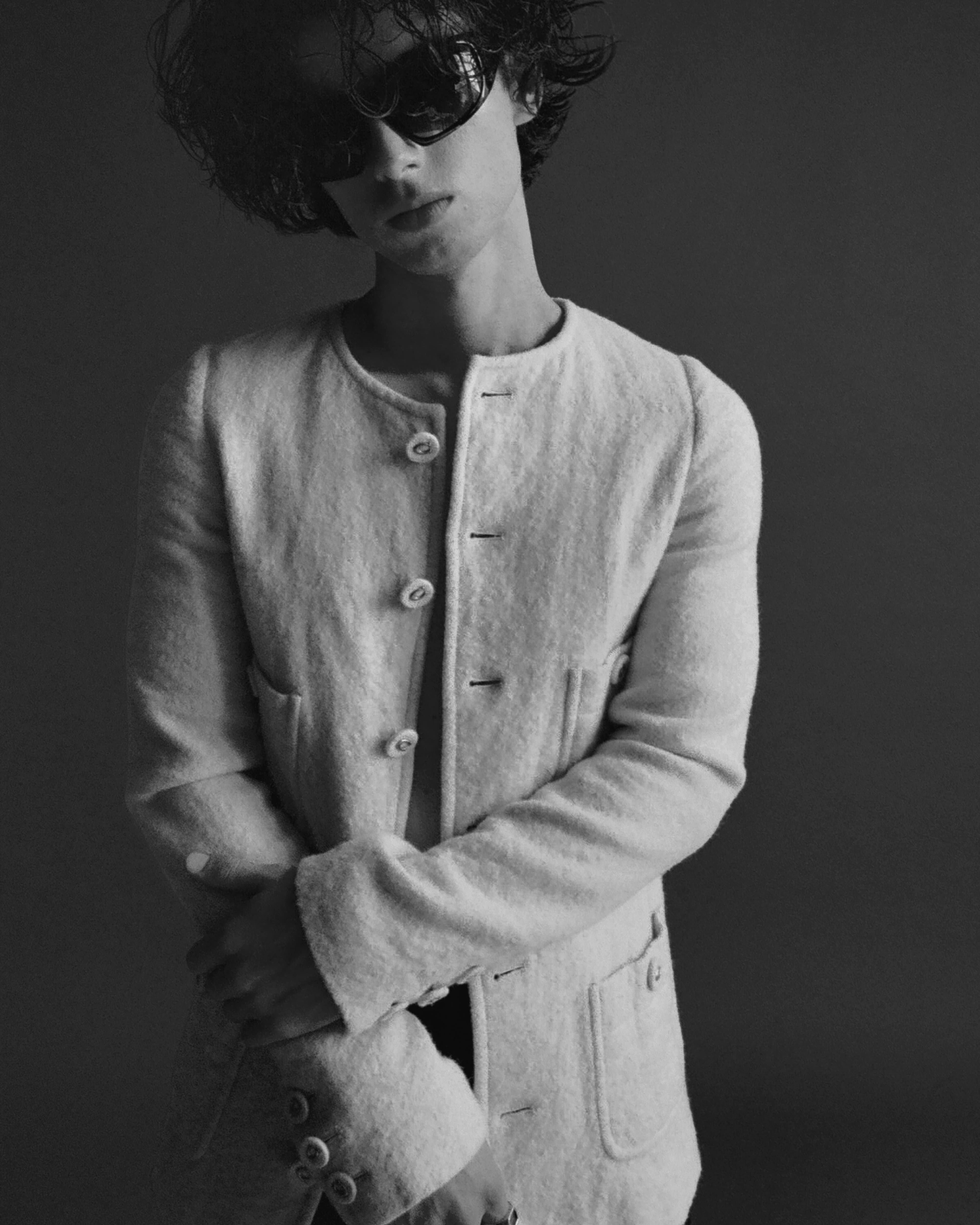 JACKET by ,Coach. ,PANTS by ,Hermès. ,SUNGLASSES by ,Givenchy.