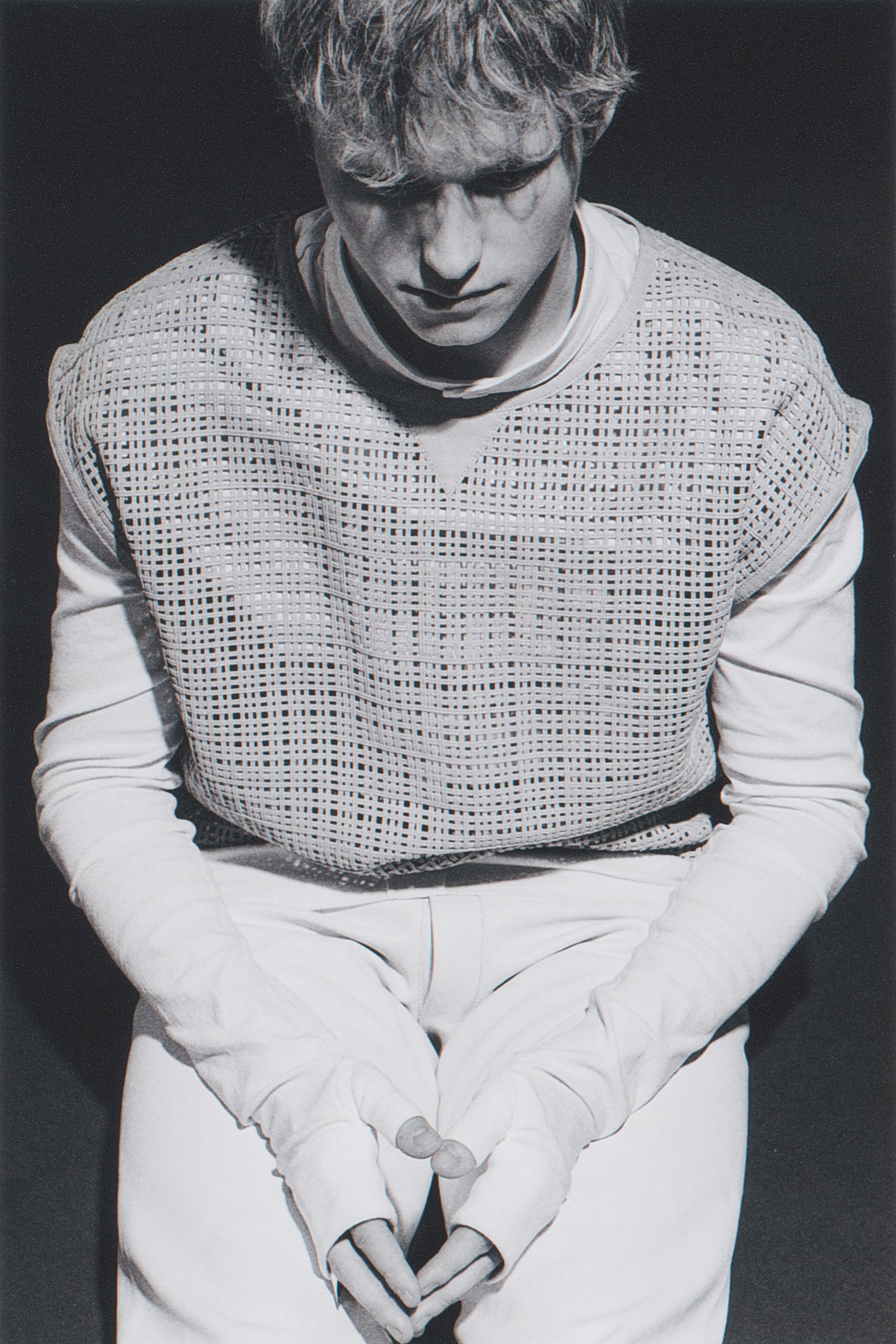 VEST by Hermès; TOP, worn underneath, and PANTS by Issey Miyake