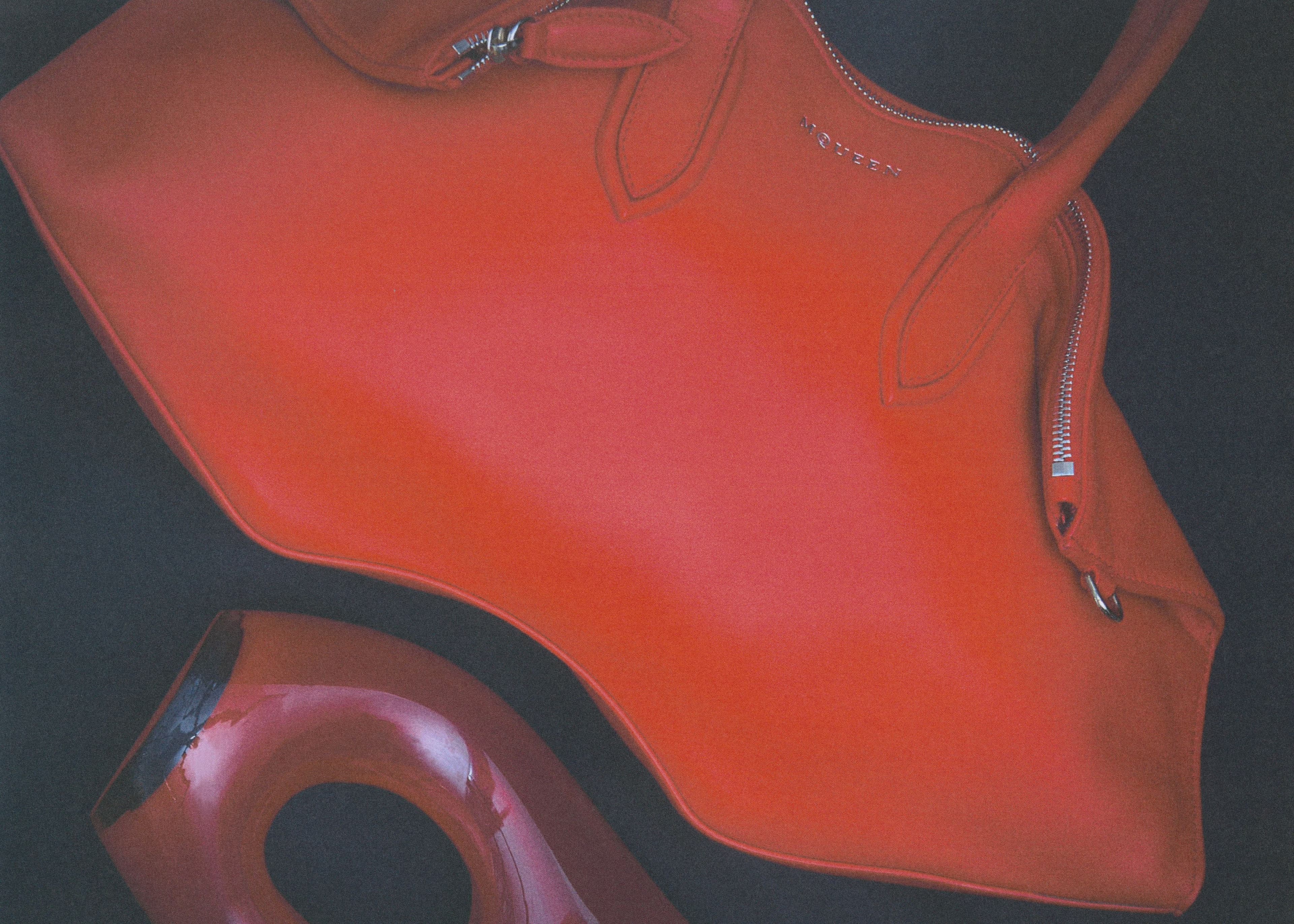 BAG by McQueen; VASE from Treaptyque