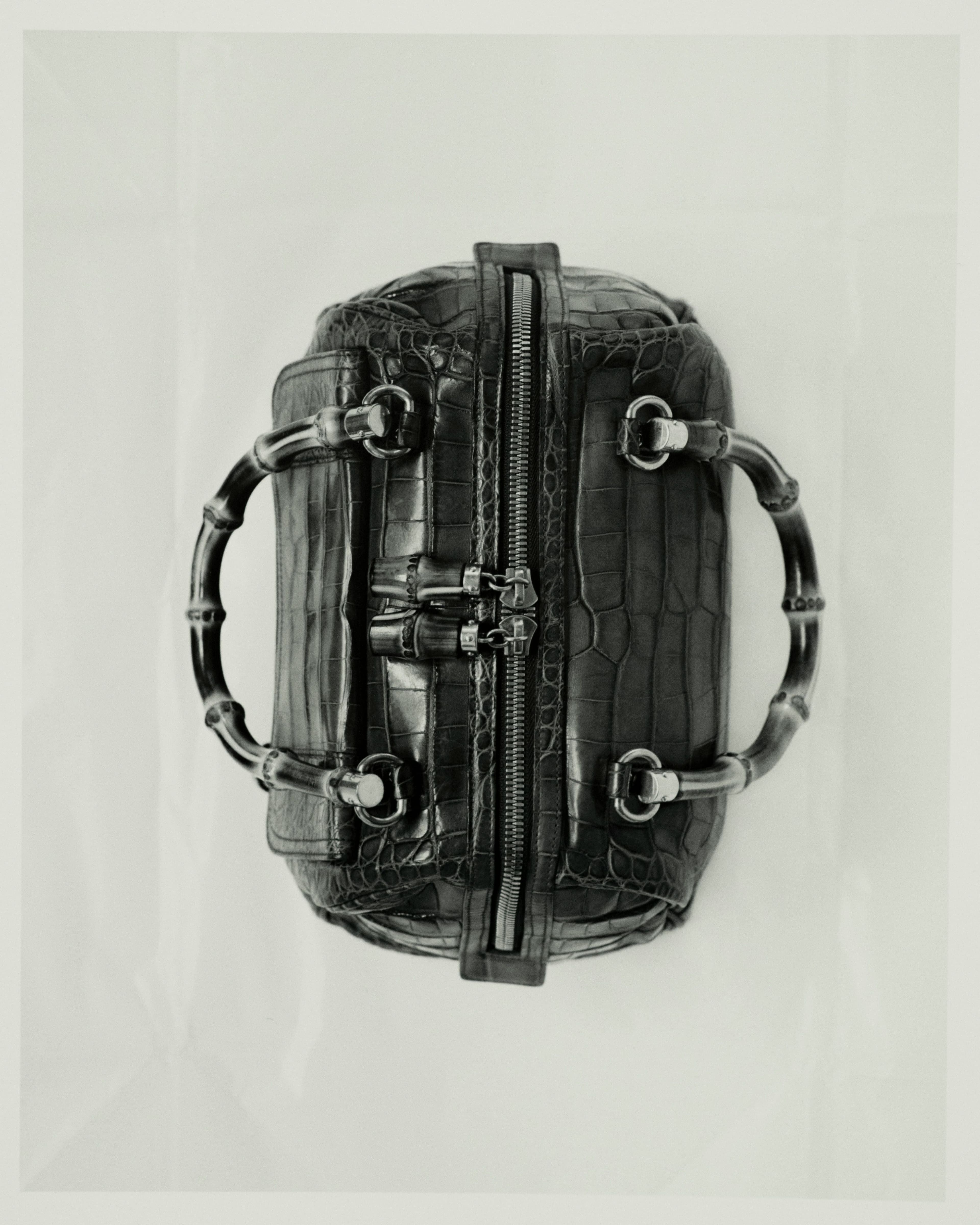 Vintage bag by Gucci, Spring 2006, from the Albright Fashion Library. After several years overseeing accessories under Tom Ford, Frida Giannini was named the creative director of Gucci in 2006. For her first collection, she revived the use of bamboo handles, which first began during World War II in response to rationing of leather.