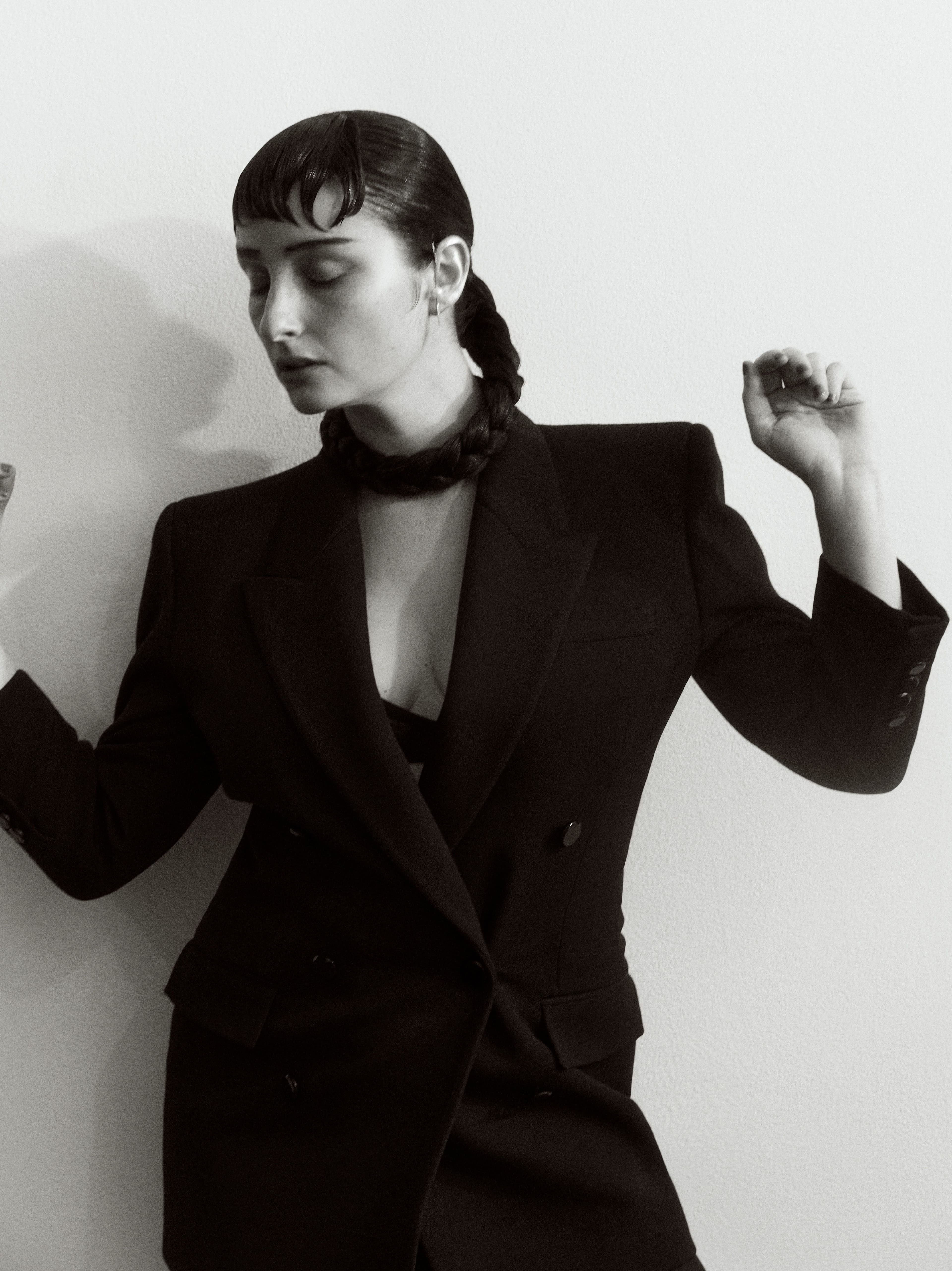 Jacket by Saint Laurent. Earrings by Austin James Smith.