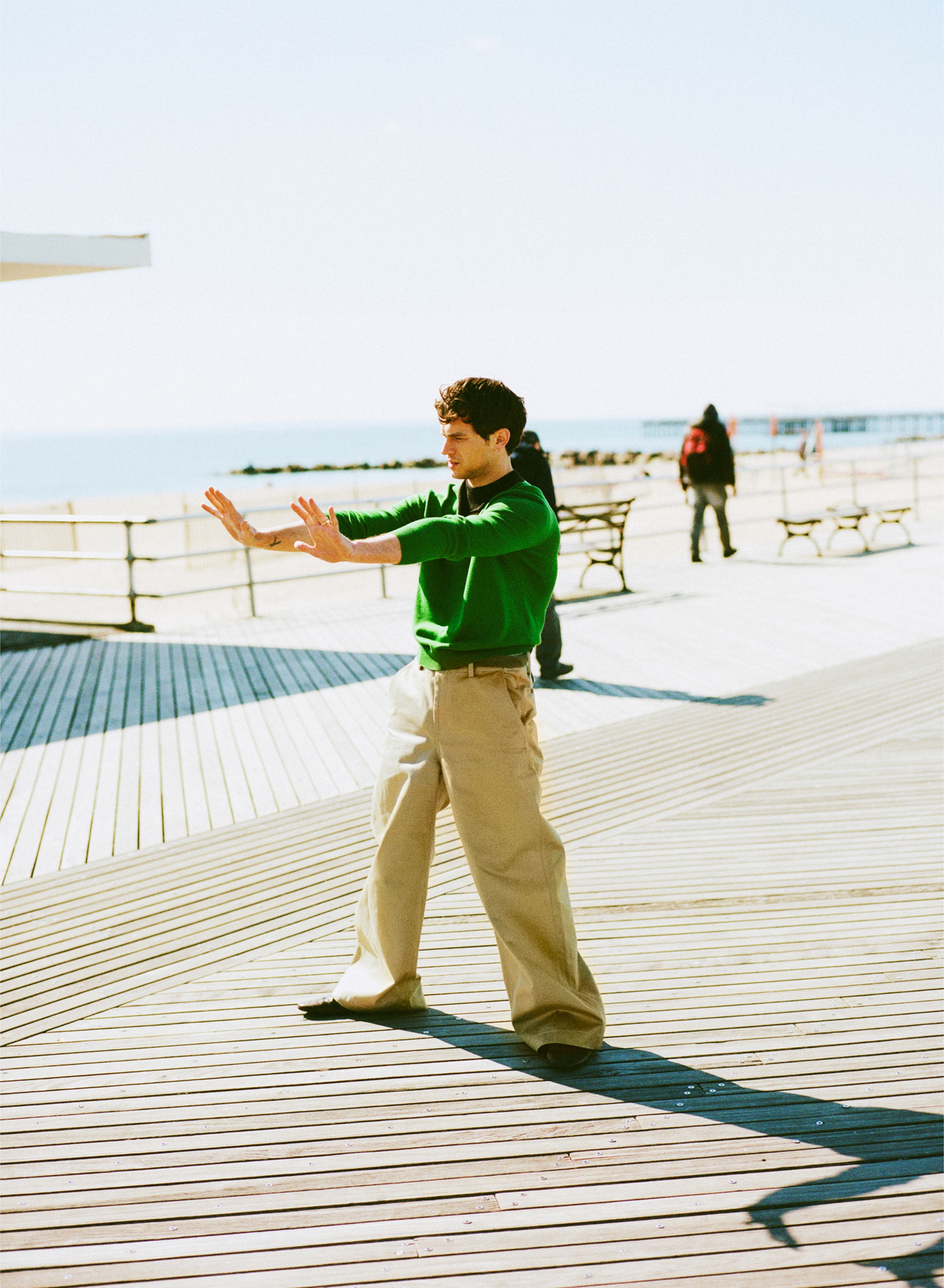 TOP and SHOES by ,Prada., PANTS by ,Sacai.