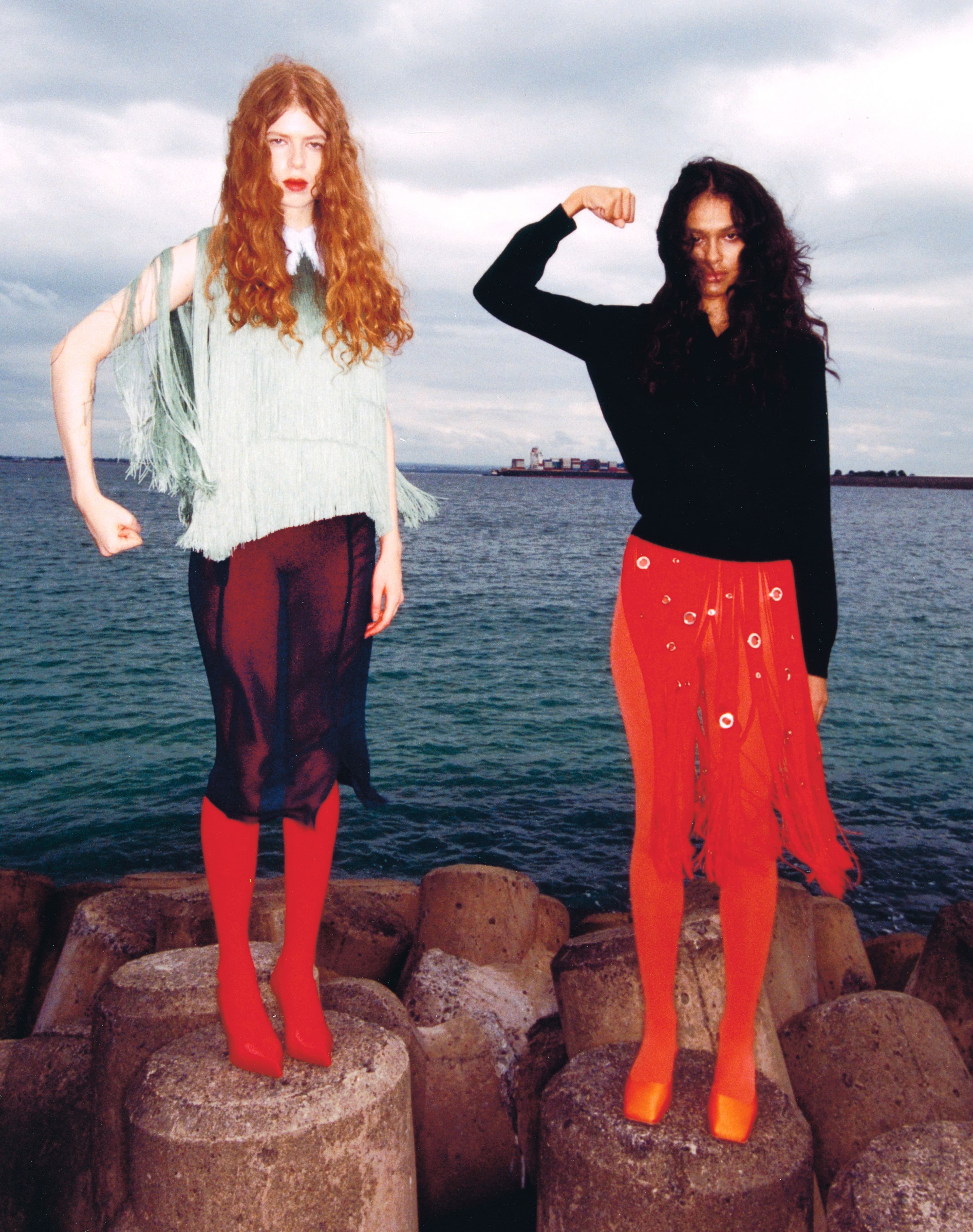 From left, TOP, SKIRT, and SHOES by ,Prada. ,TIGHTS, stylist’s own. SWEATER, SKIRT, and SHOES by ,Prada., TIGHTS, stylist’s own.