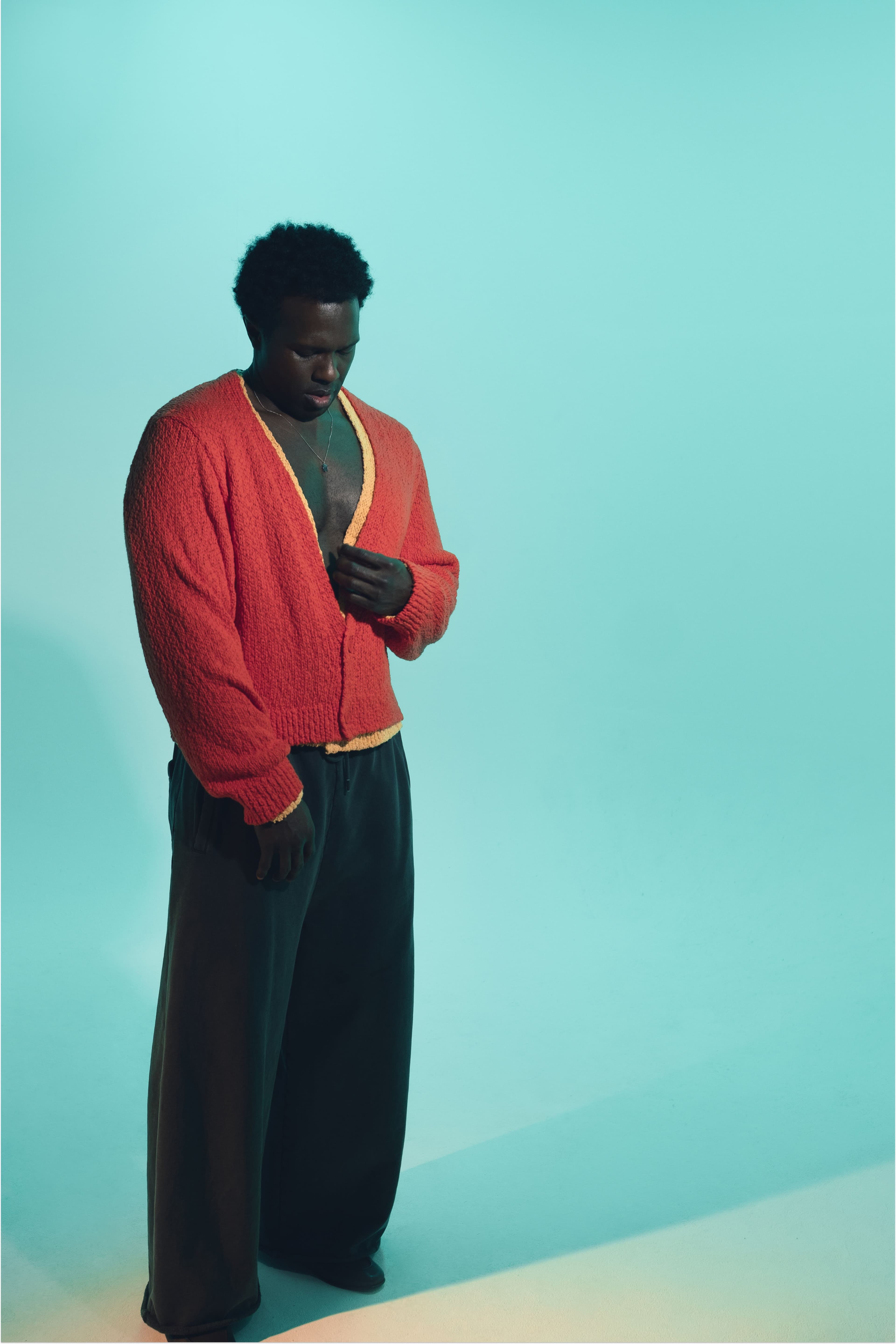 SWEATERS by Issey Miyake; PANTS by Lu’u Dan; SHOES by Santoni