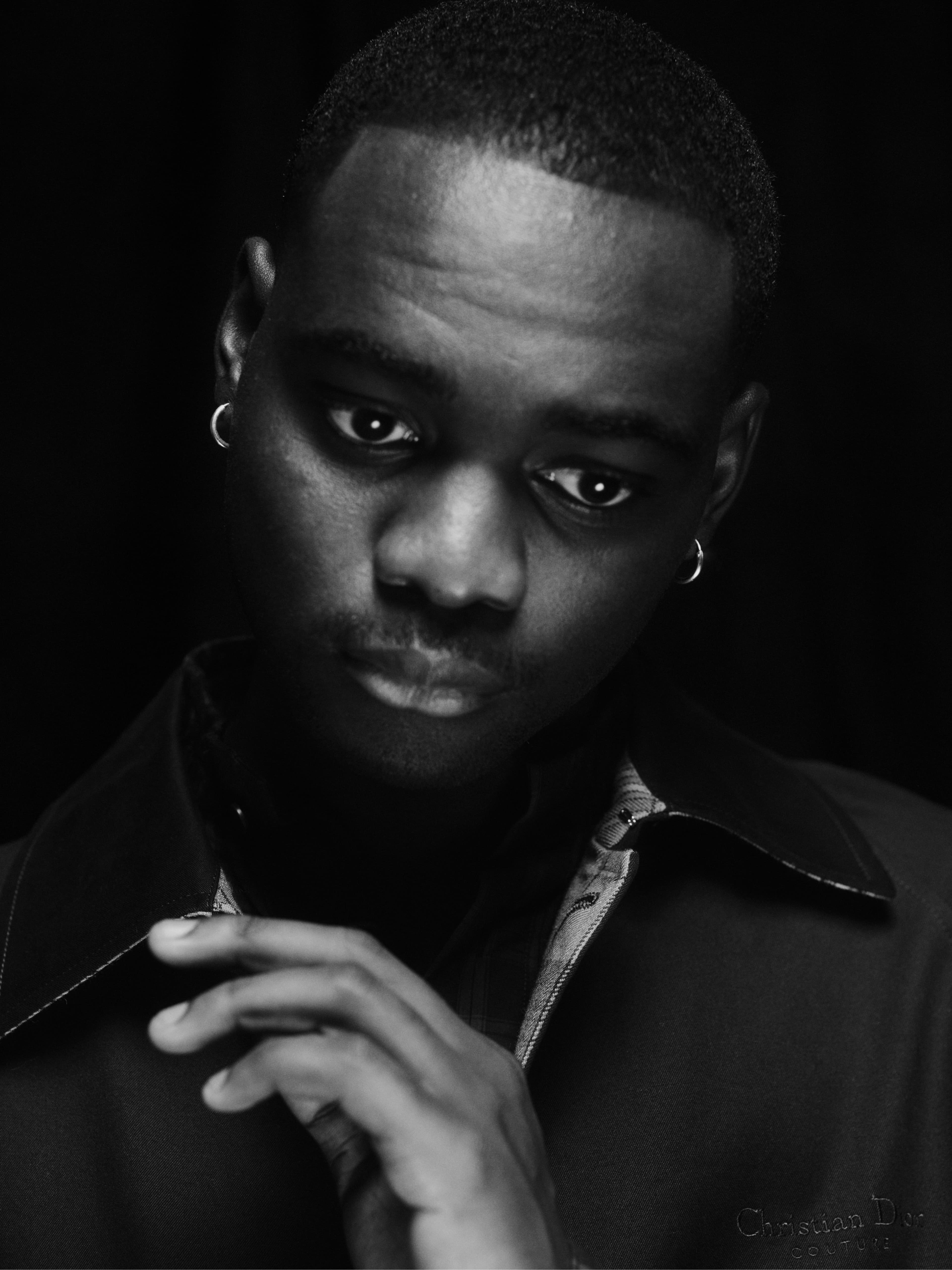 COAT by ,Dior Men., SHIRT by ,Loewe.