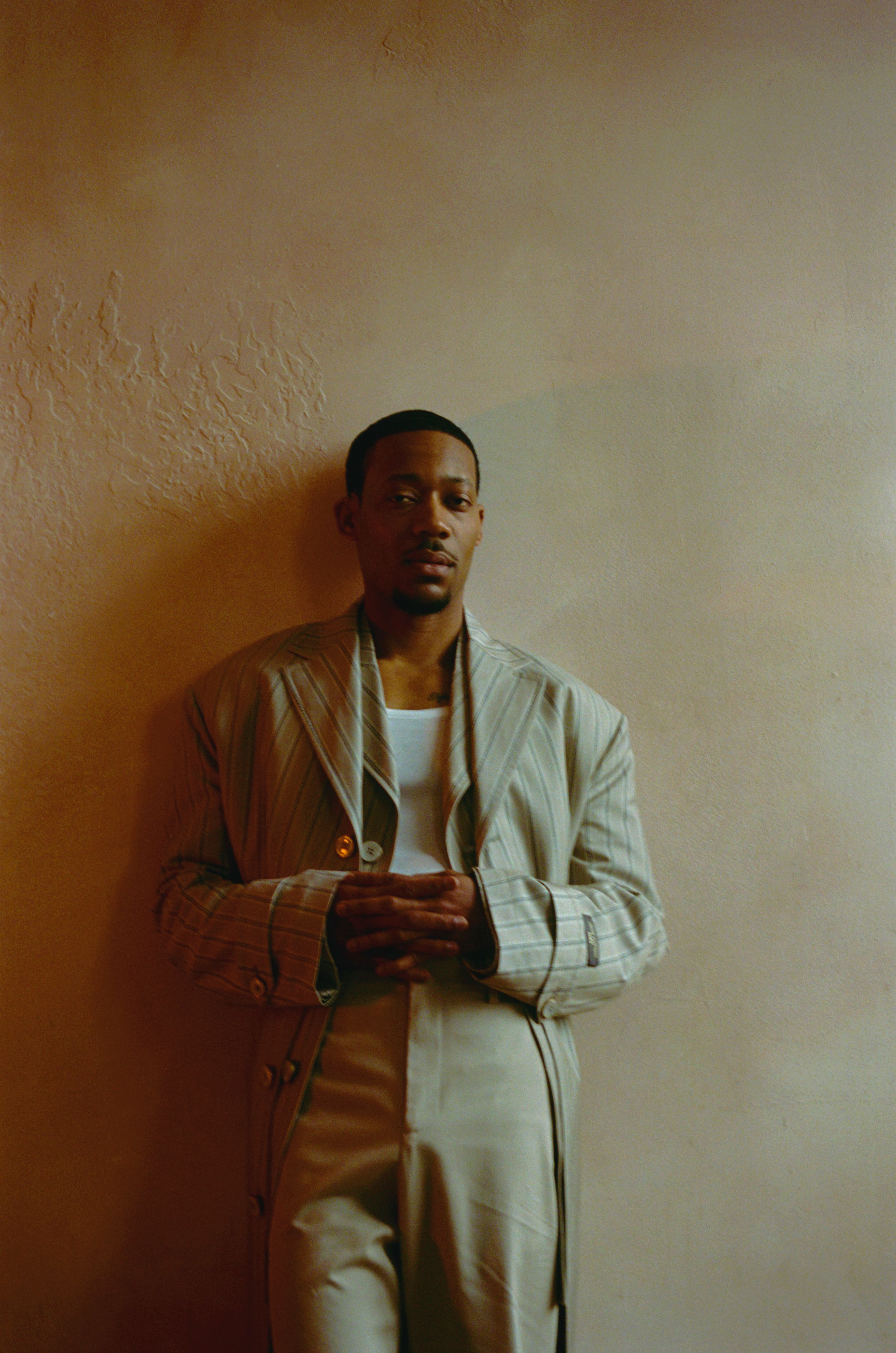 JACKET and PANTS by Louis Vuitton. TOP by Hanro.