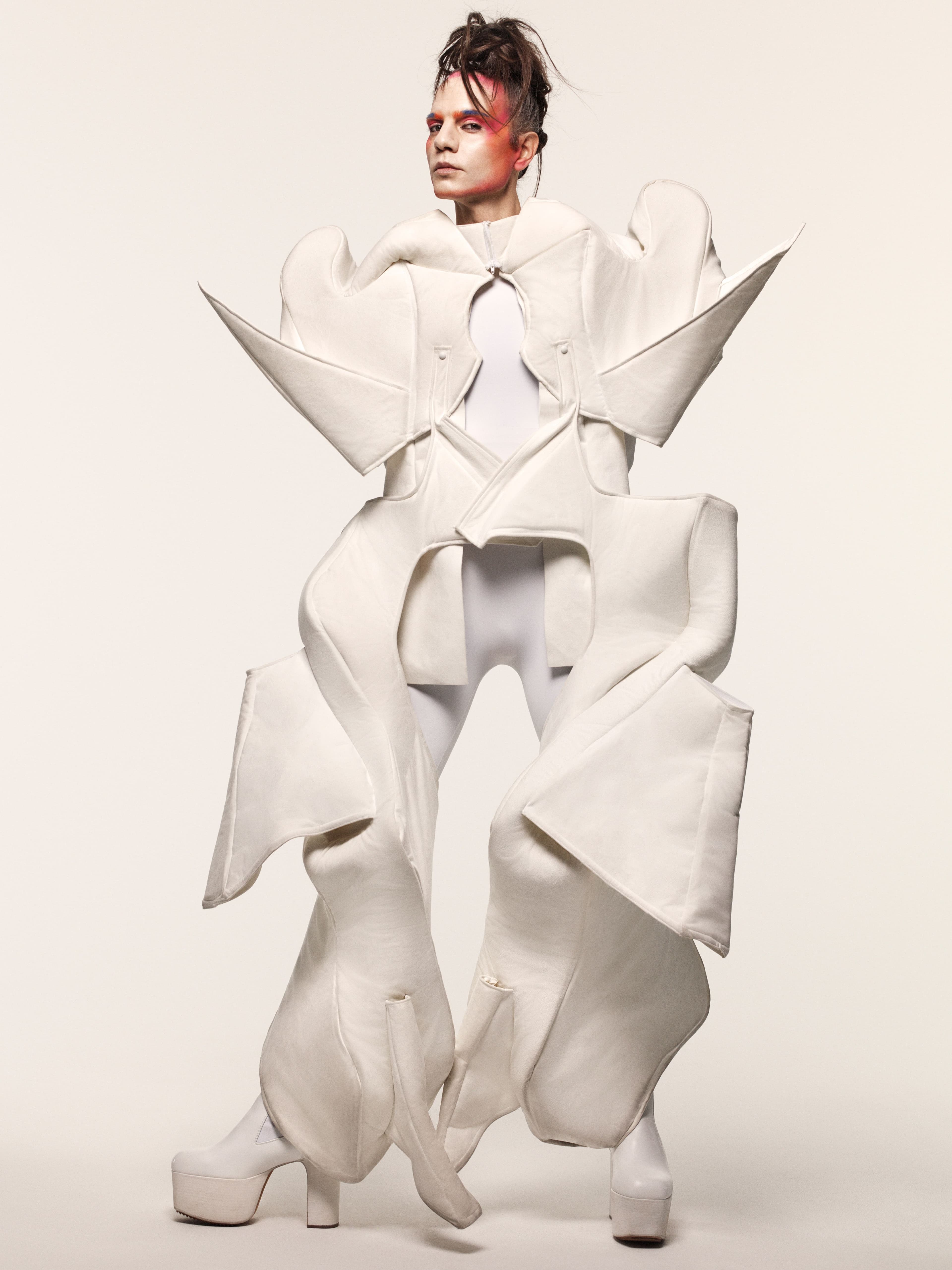 Cape by Yuze Lix. Bodysuit by Wolford. Boots by Rick Owens.