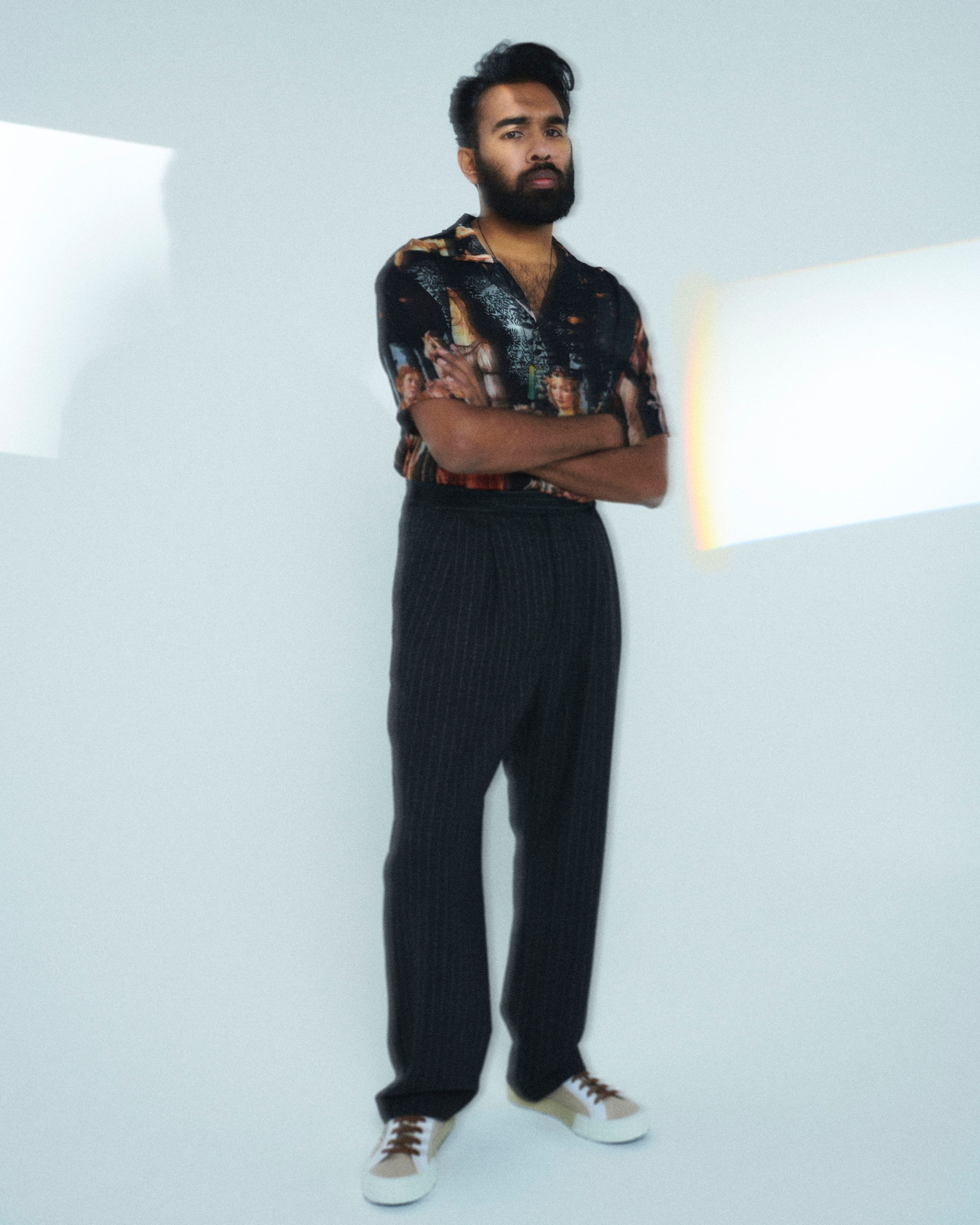 Vintage shirt from the Contemporary Wardrobe Collection. Pants by ADNYM. Sneakers by Prada. Necklace, Patel’s own.