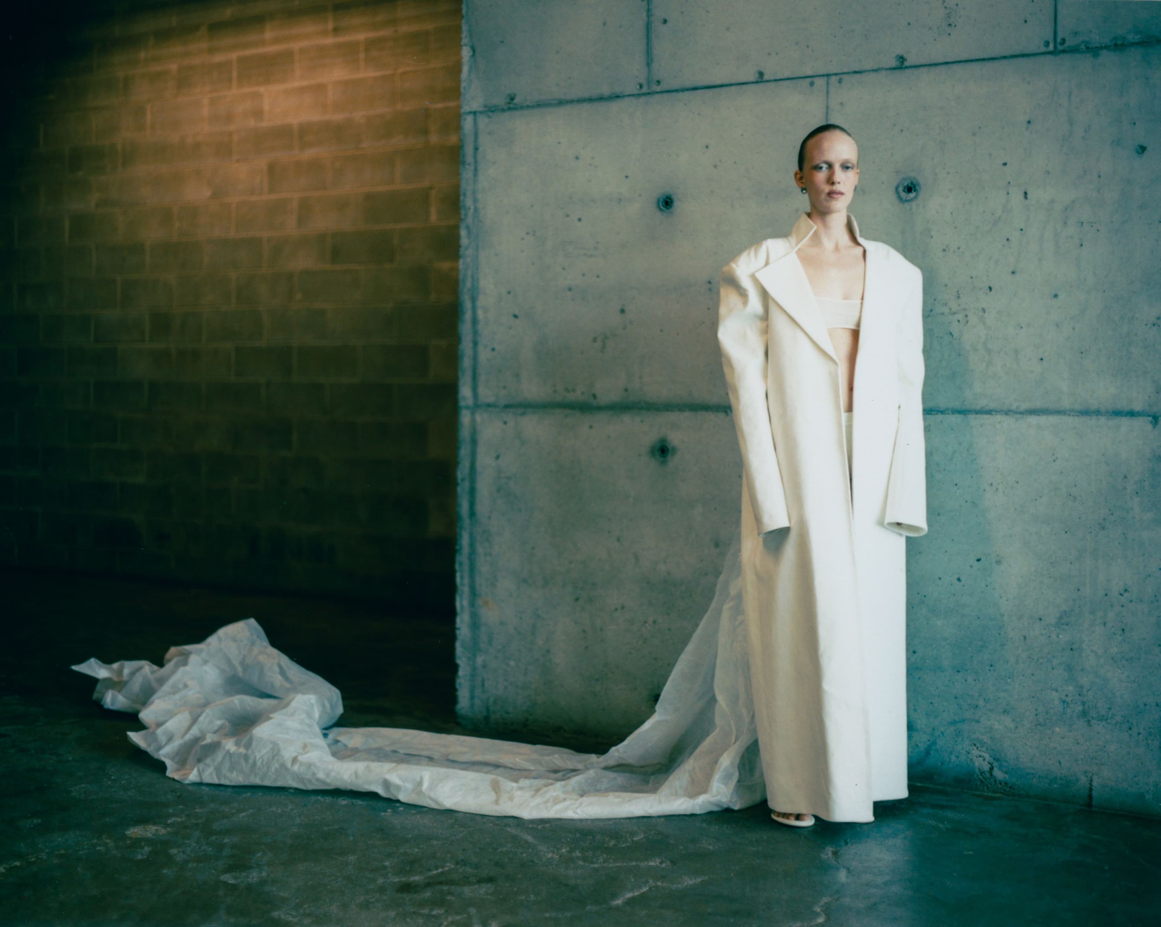 JACKET by Evacuate from Meaning by Jiangyuan Ai; BRA and SHORTS by Jane Wade; SHOES by Zellous