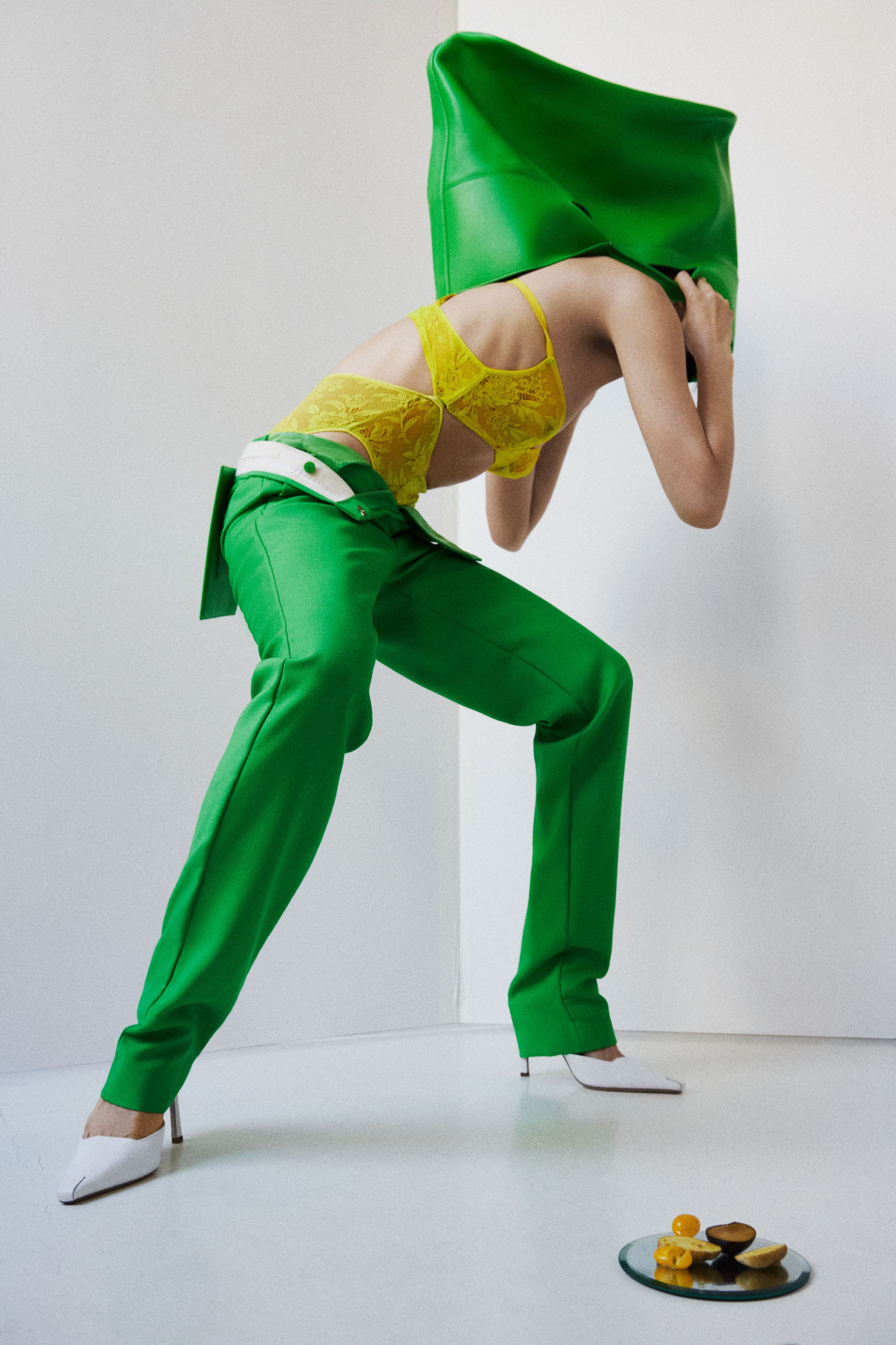 Underwear by Araks. Pants and bag by Alexander McQueen. Shoes by Bevza.