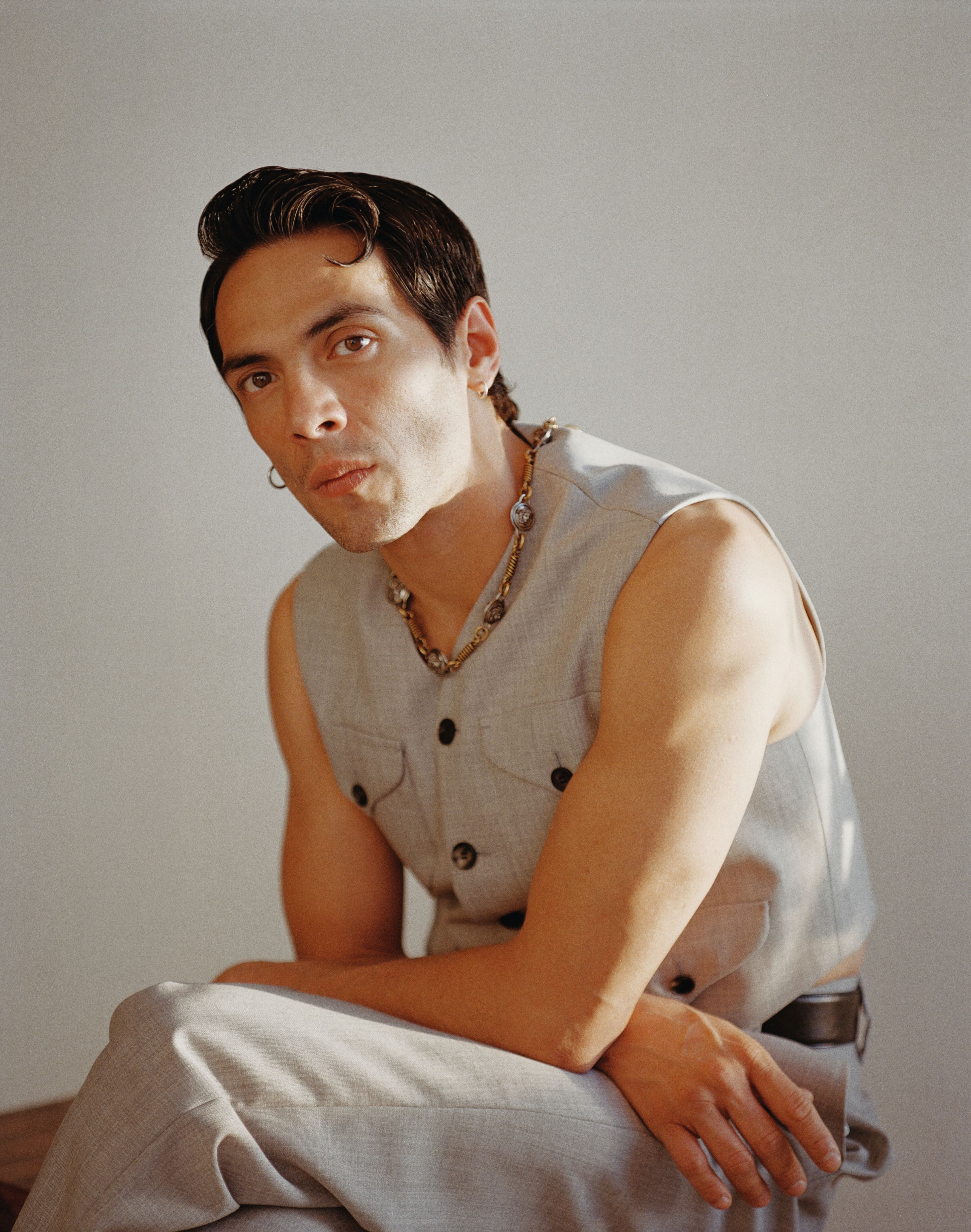 All CLOTHING, NECKLACE, and BELT by Versace