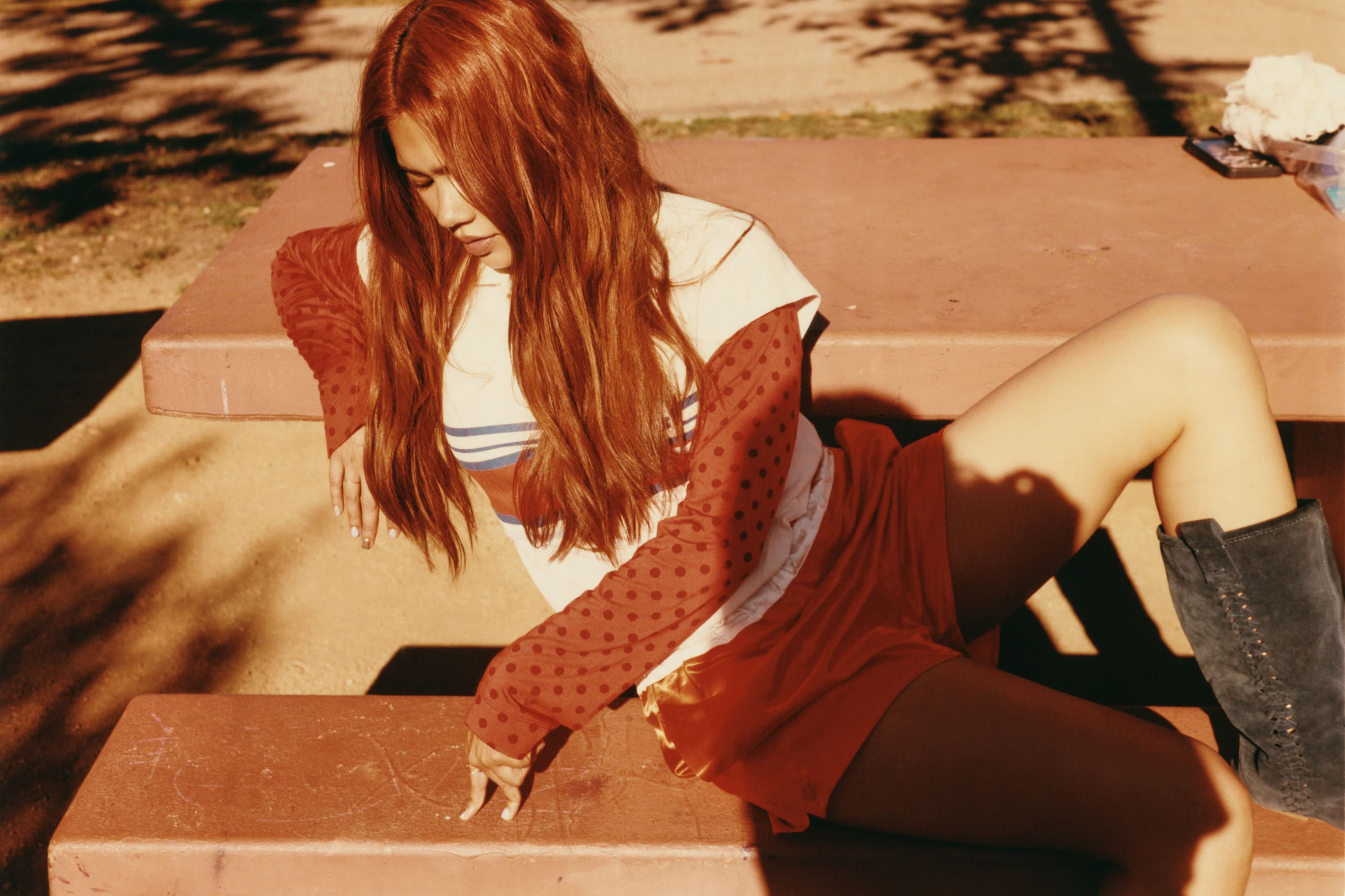TOP and SHORTS by Lacoste; TOP, worn underneath, by Rat Boi; SHOES, stylist’s own; RING by Hirotaka