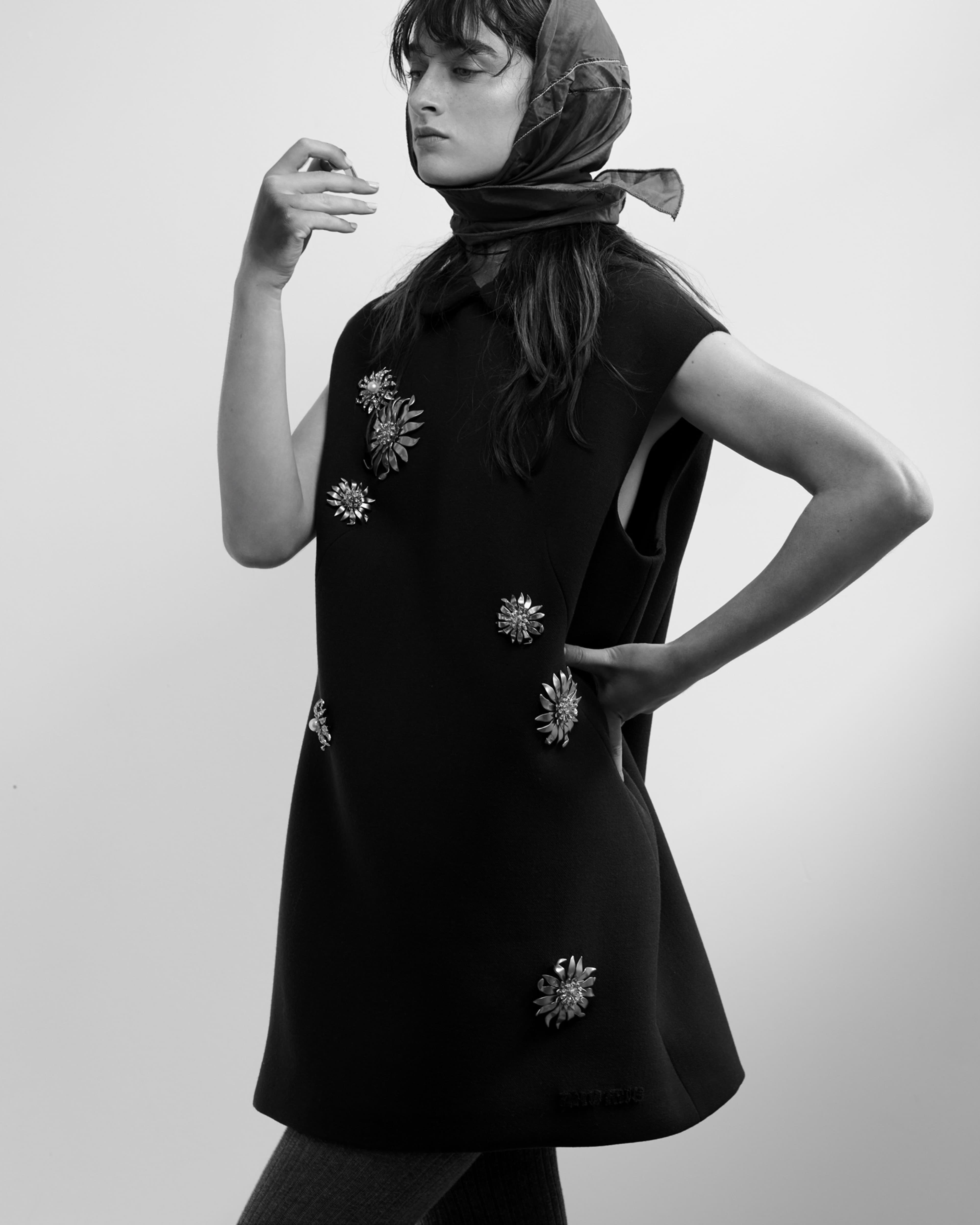 DRESS and TIGHTS by ,Miu Miu., HEADSCARF, stylist’s own.