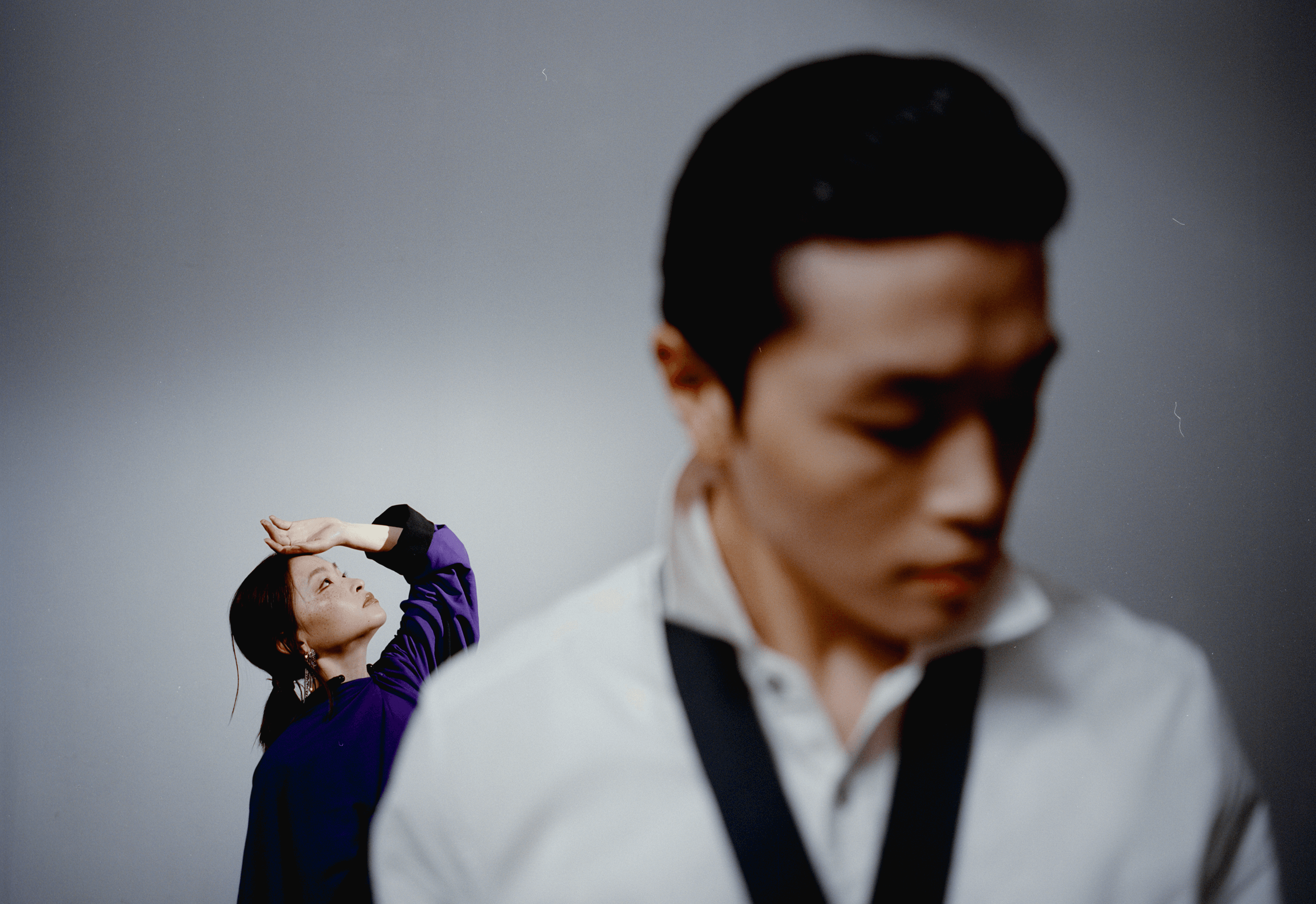 Maia wears JUMPSUIT by Yohji Yamamoto. EARRINGS by Nickho Rey. NECKLACE and BRACELET by Saule. Alex wears SHIRT and TIE by Louis Vuitton.