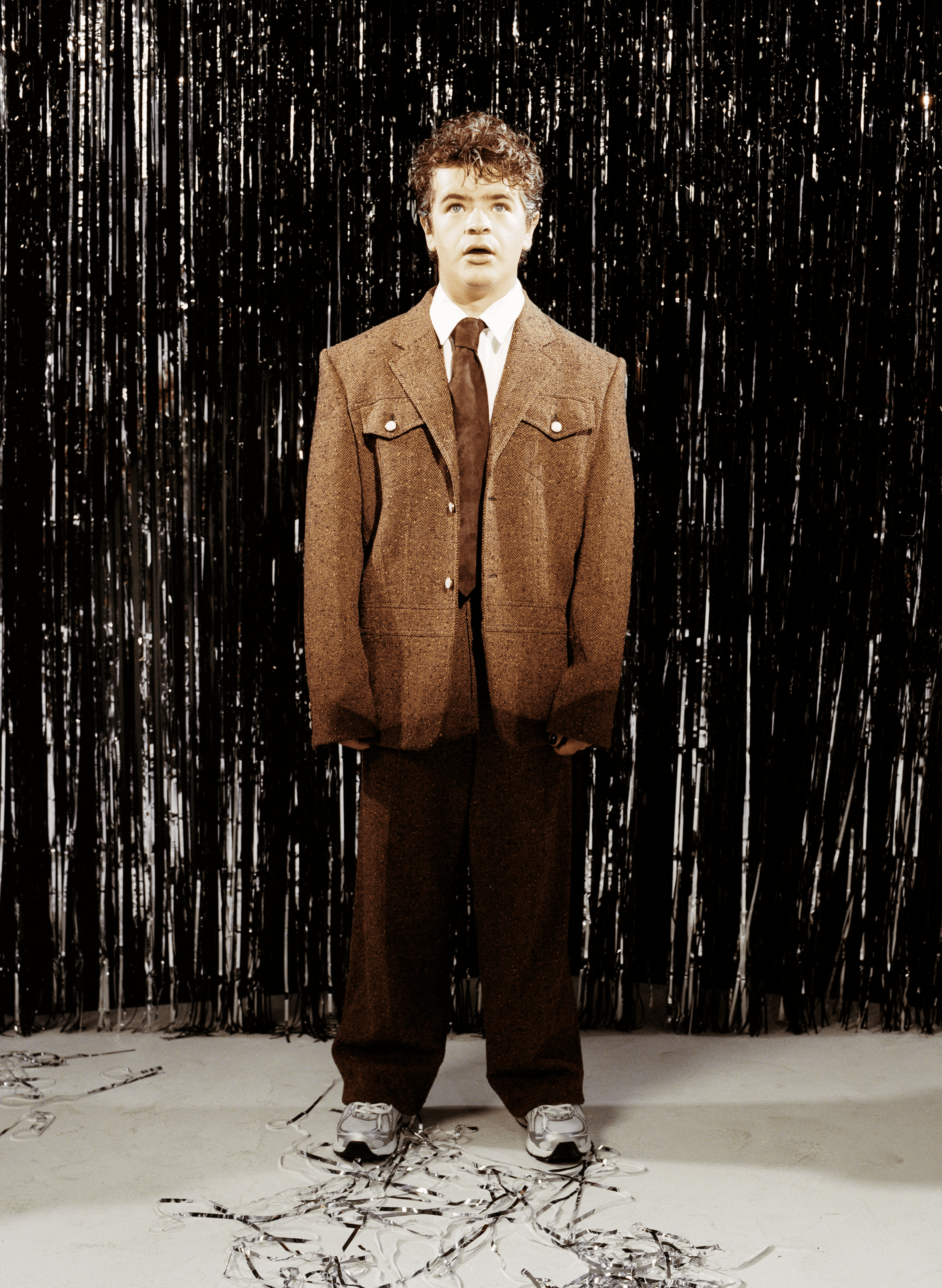 JACKET and PANTS by Louis Vuitton. SHIRT by Dries Van Noten. TIE by Todd Snyder. SHOES by New Balance.