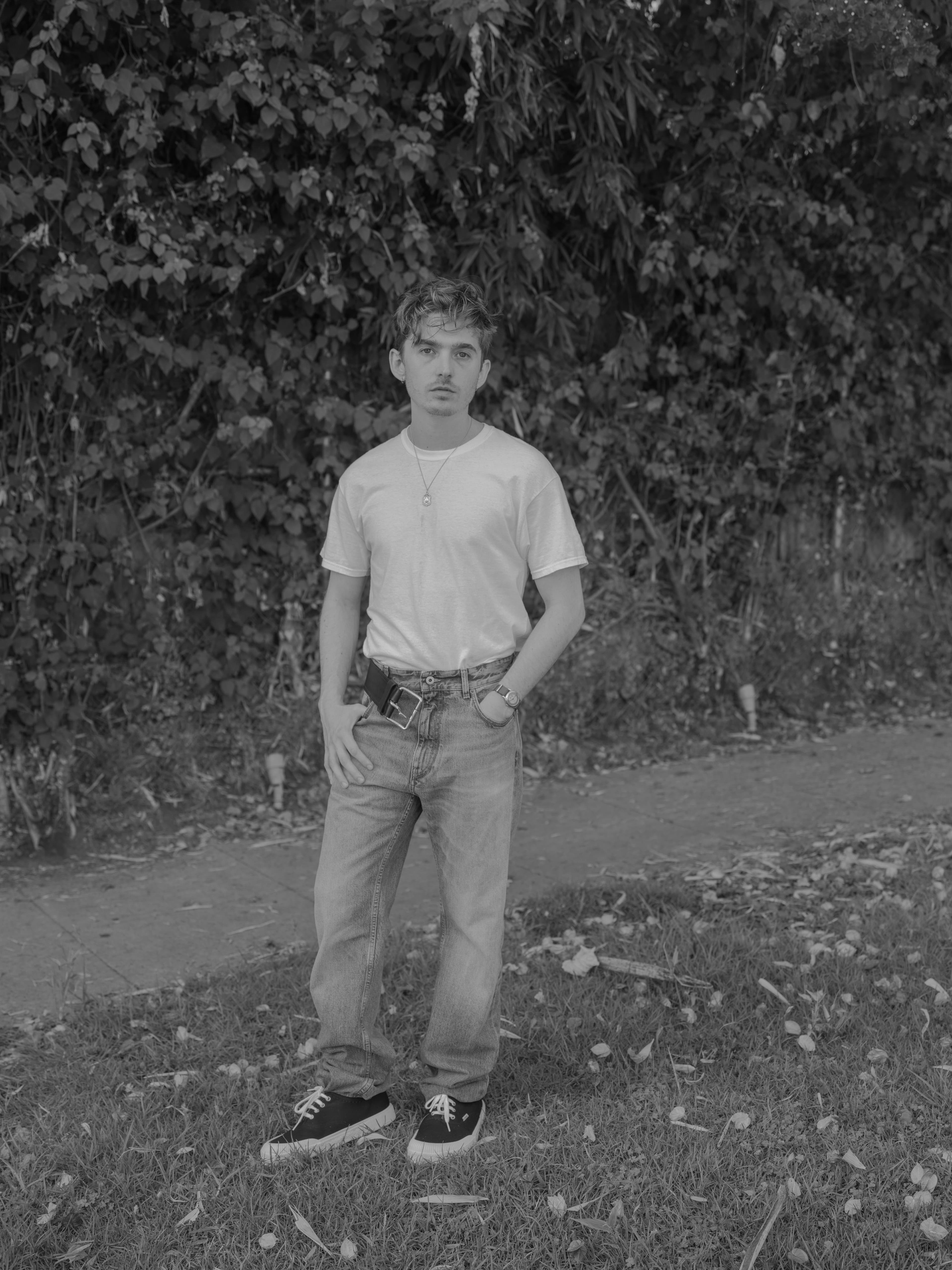 T-SHIRT and NECKLACE, stylist’s own. PANTS and SHOES by ,Loewe. ,WATCH, Abrams’s own.