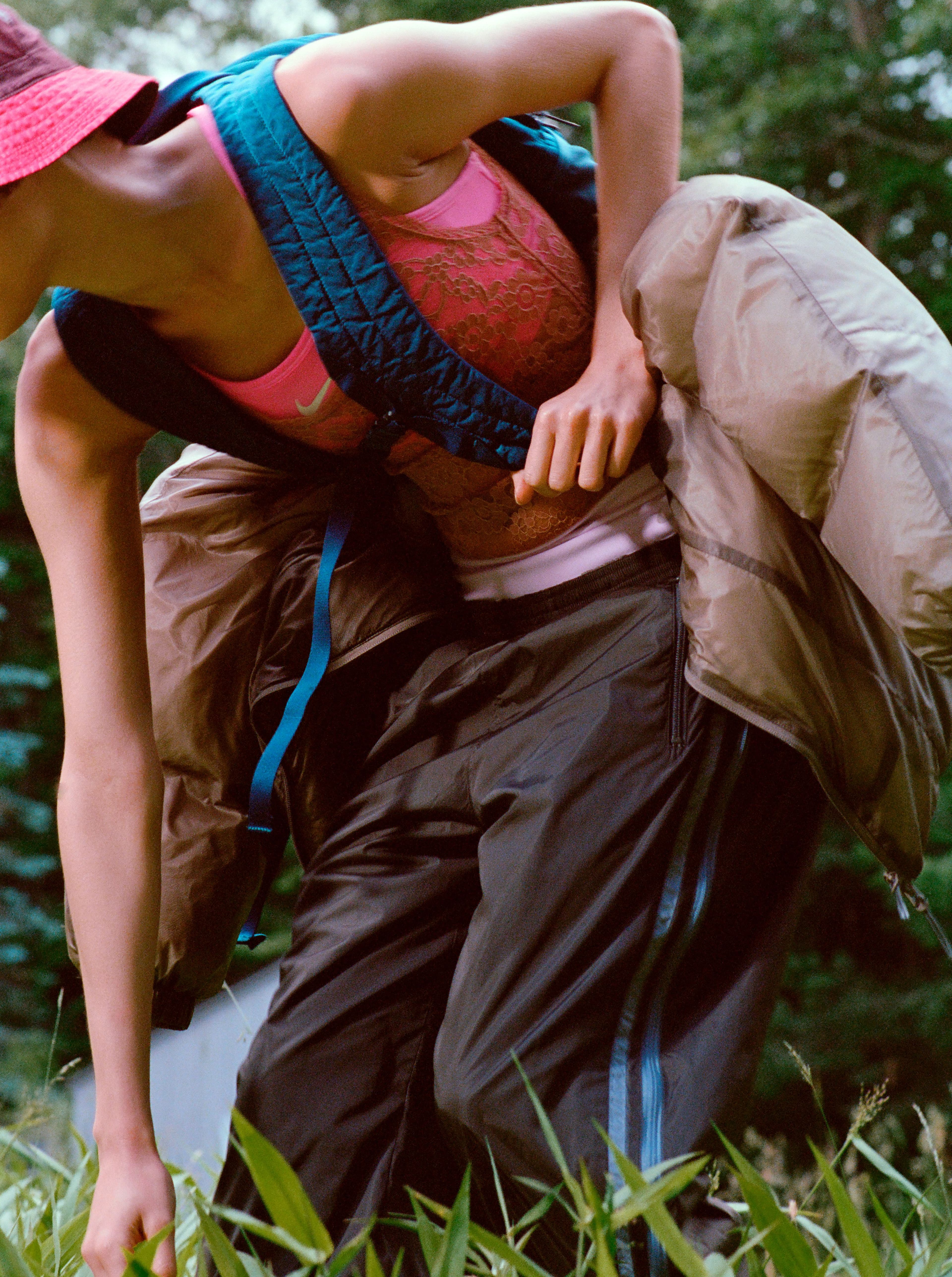 BODYSUIT by ,Eres,. BRA and SHORTS by ,Nike. ,PANTS by ,6397,. JACKET, worn on back, by ,ROA. ,HAT and BAG by ,C.P. Company.