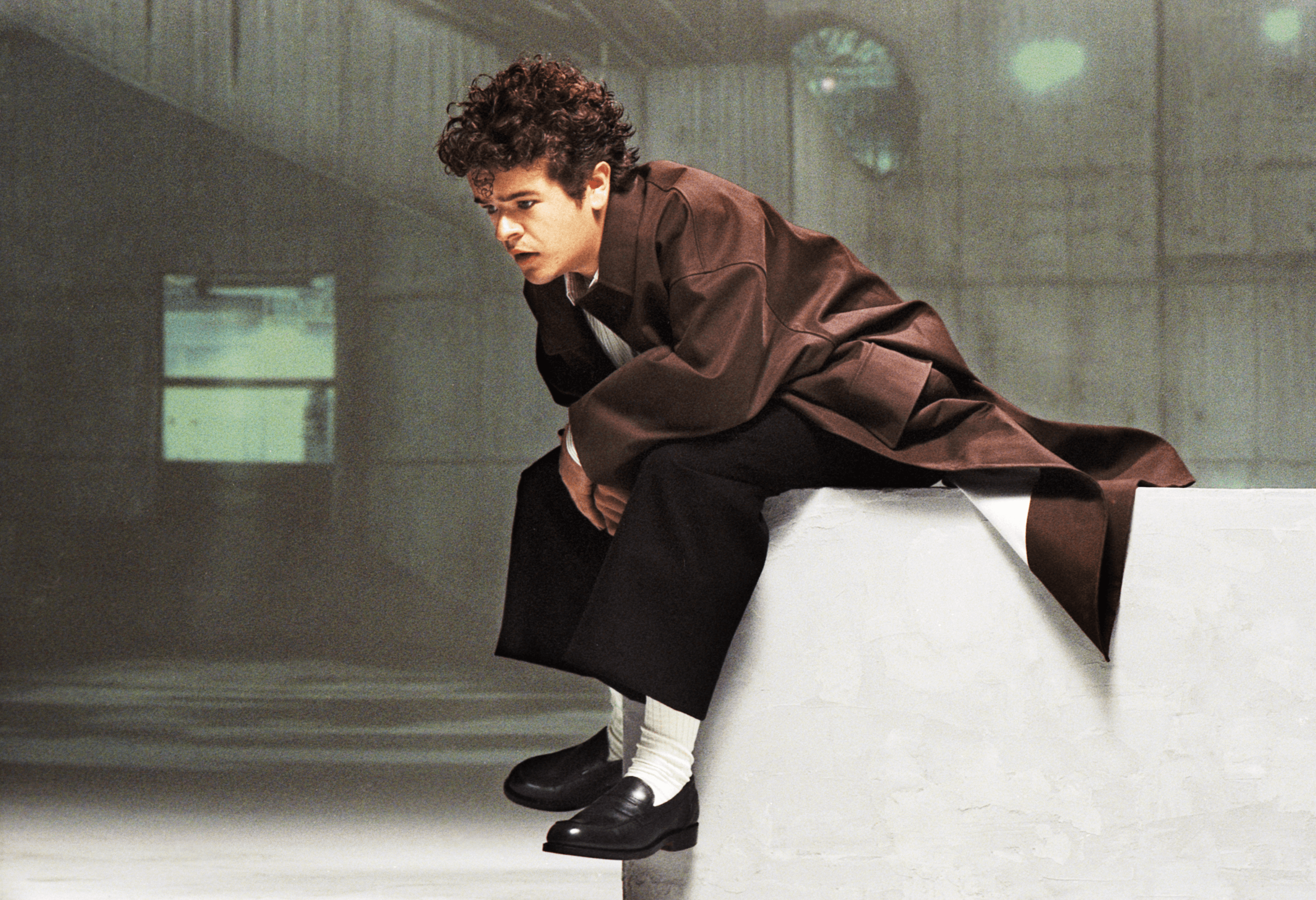 COAT by Todd Snyder. SHIRT by Canali. PANTS by Hermès. SOCKS by Falke. SHOES by Manolo Blahnik.