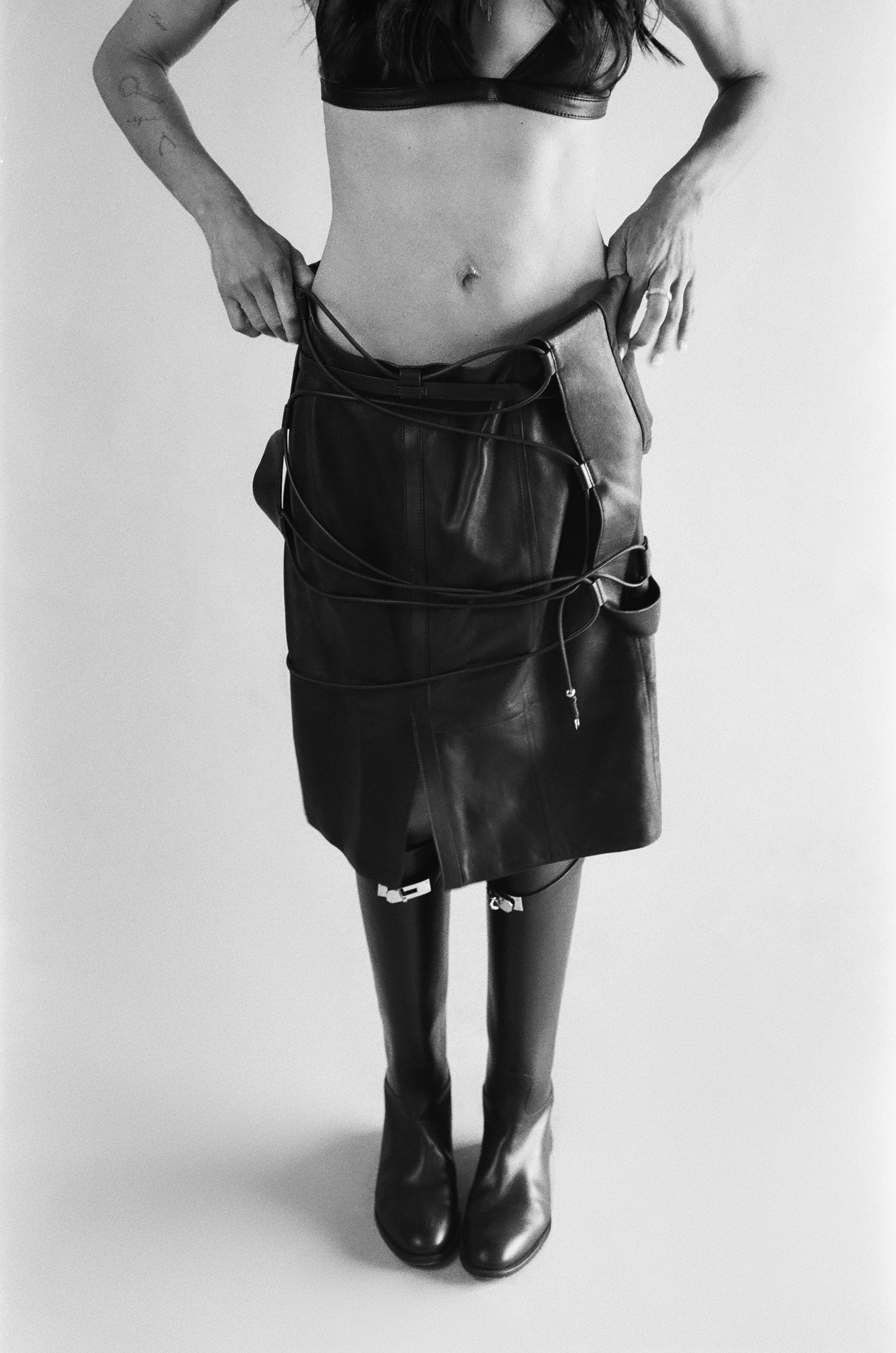 All CLOTHING and BOOTS by Hermès; all JEWELRY by Shay Jewelry