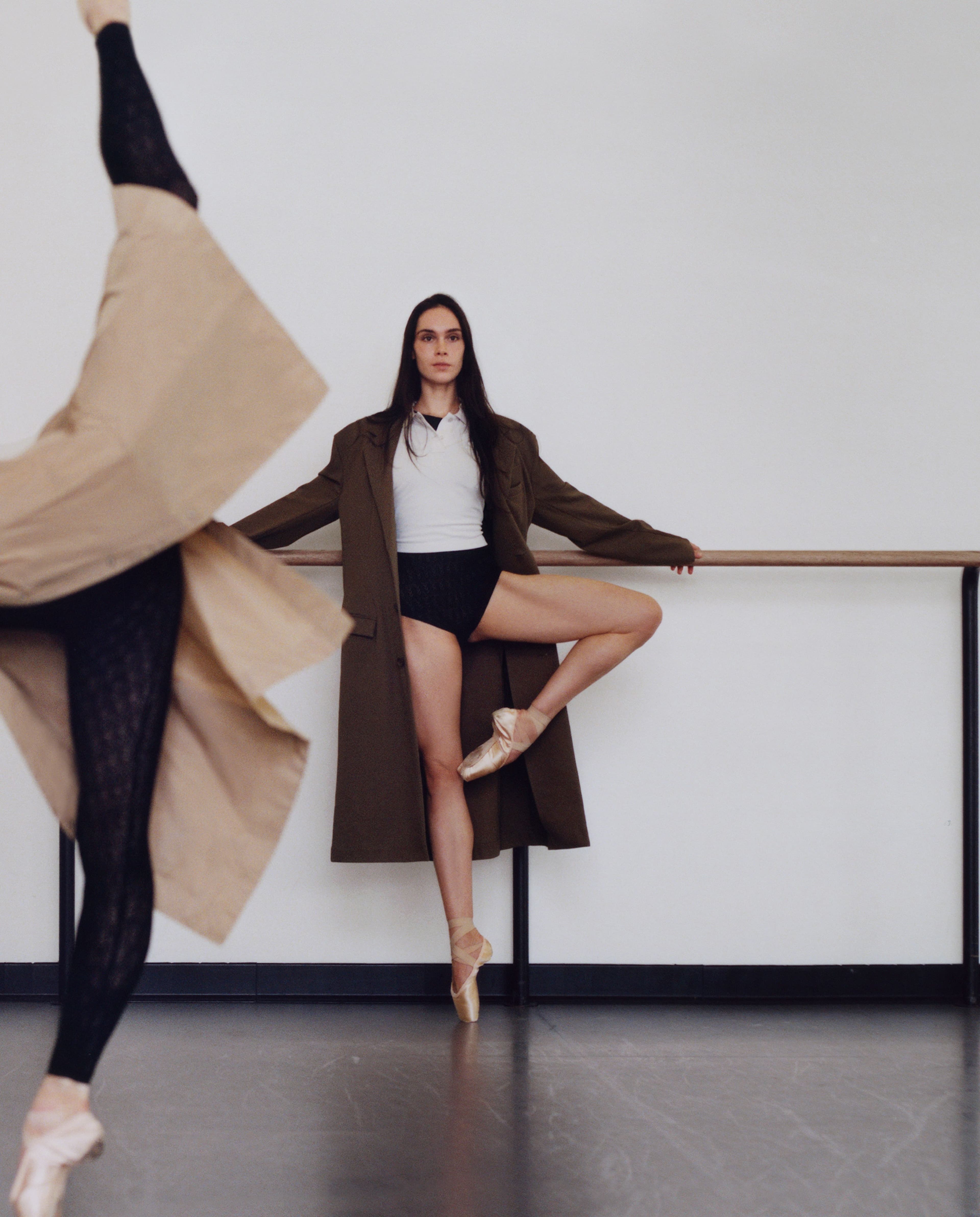 FROM LEFT: Misseldine wears COAT by Leset; BODYSUIT by Ely Ely. Nadon wears COAT by Issey Miyake; TOP by Balenciaga; BODYSUIT by Ely Ely.