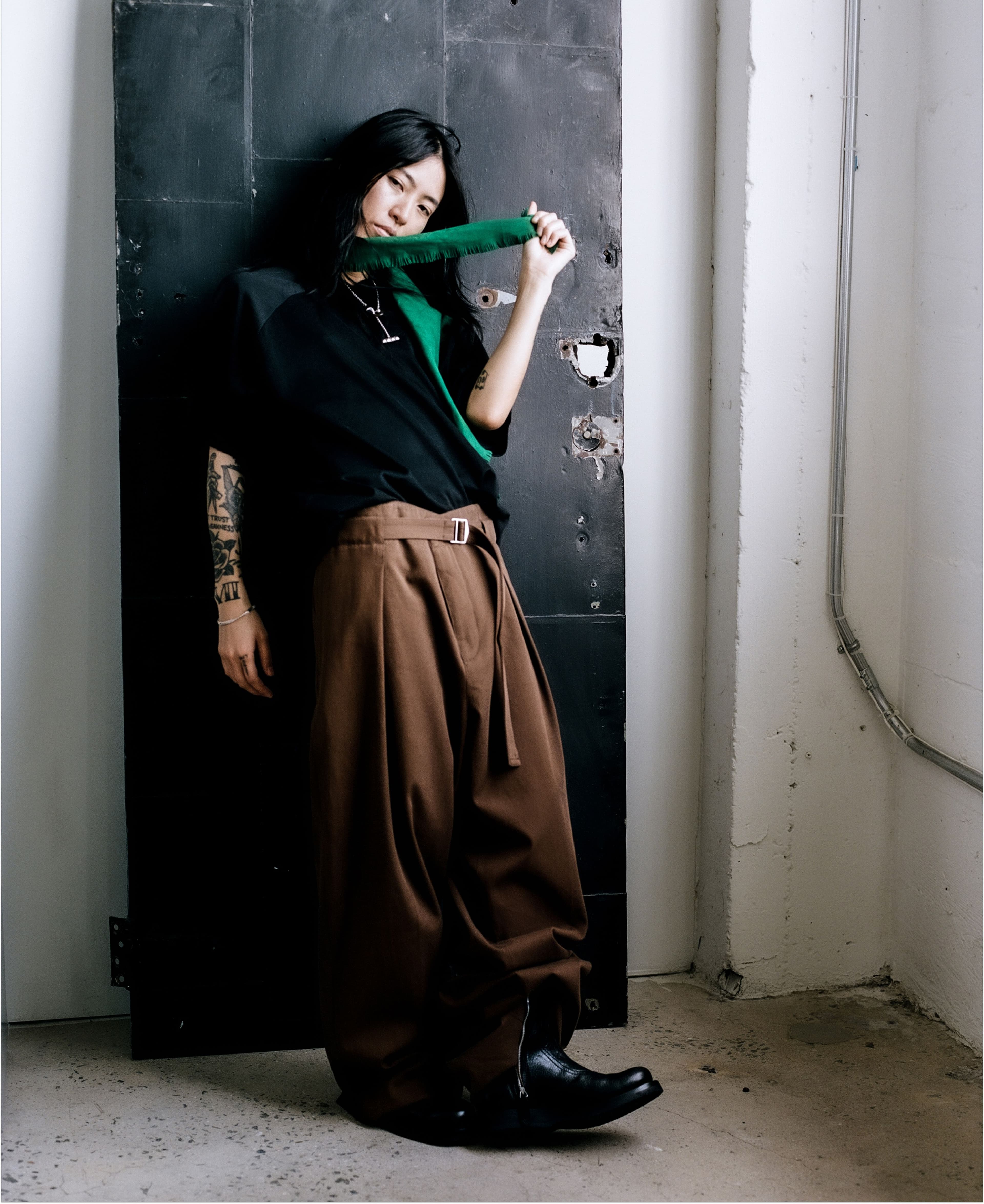 TOP by 6397; PANTS, SCARF, and NECKLACE by Hermès; SHOES by Our Legacy; BRACELET, worn throughout, talent’s own