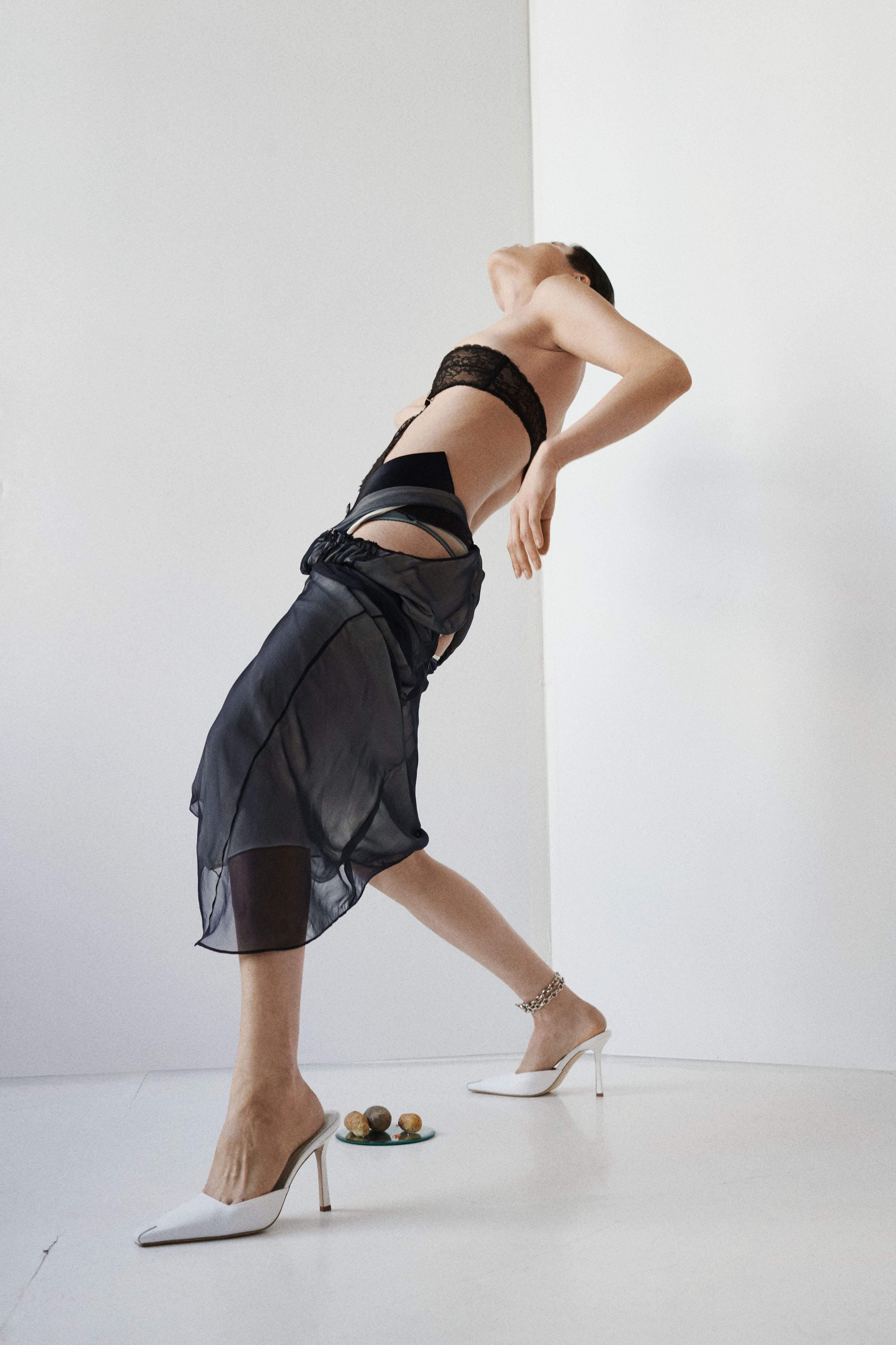 Dress and shoes by Bevza. Bodysuit by Gucci. Ear cuff by Alexander McQueen. Necklace by White Space. Anklet by Laura Lombardi.