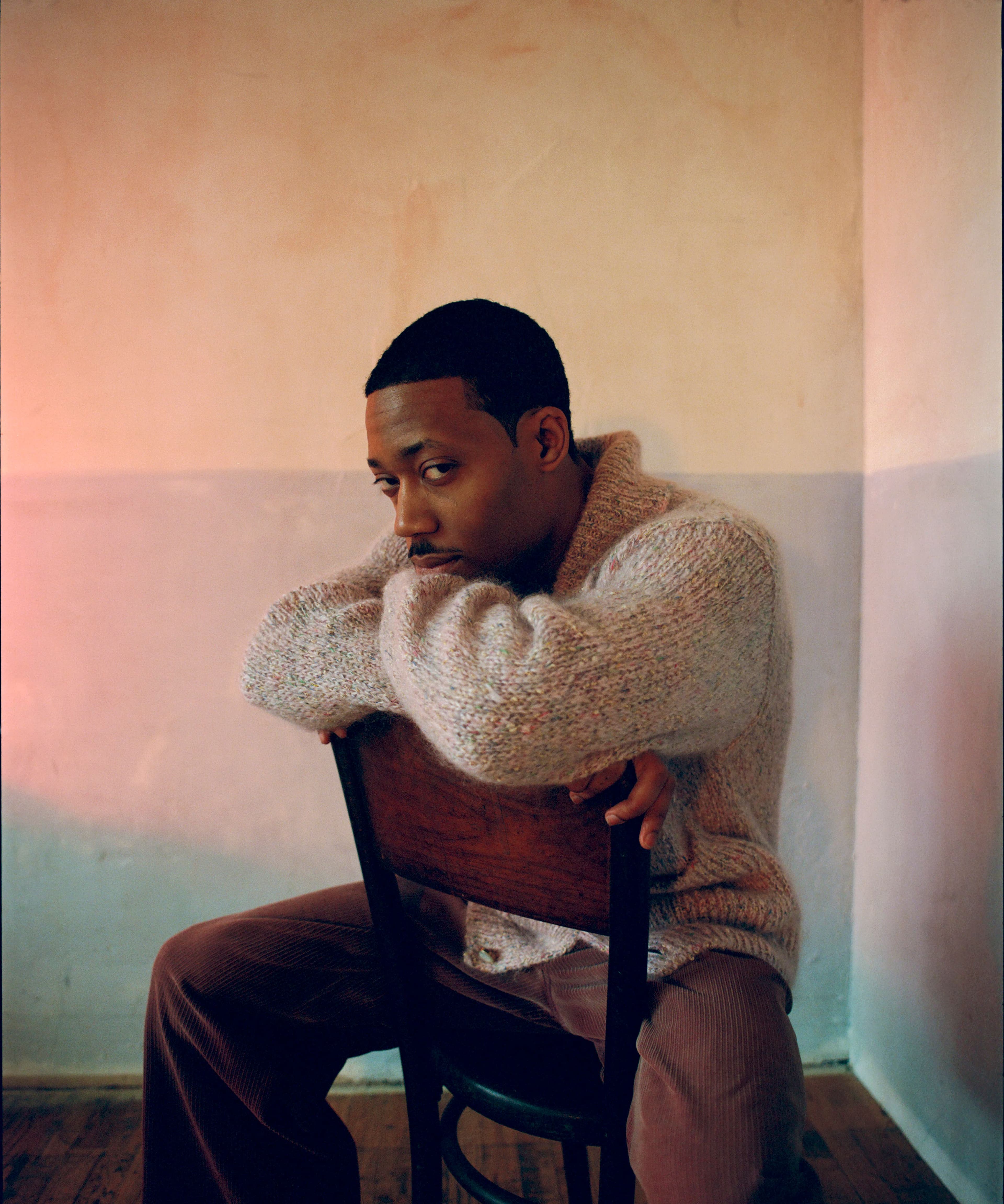 SWEATER by Louis Vuitton. PANTS by Dior.