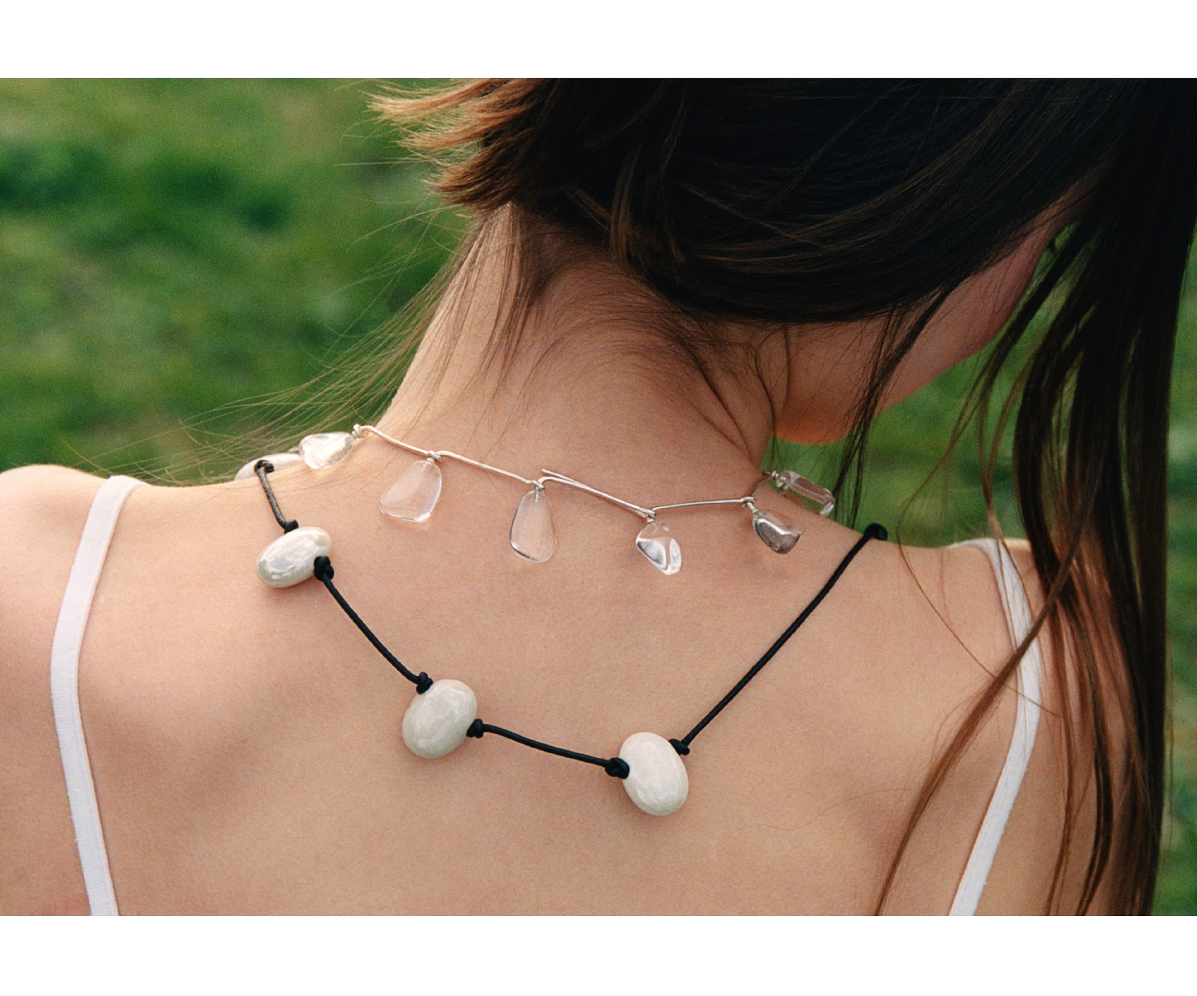 Vintage TOP, stylist’s own; NECKLACES, top to bottom, by Mussels and Muscles and PRUM