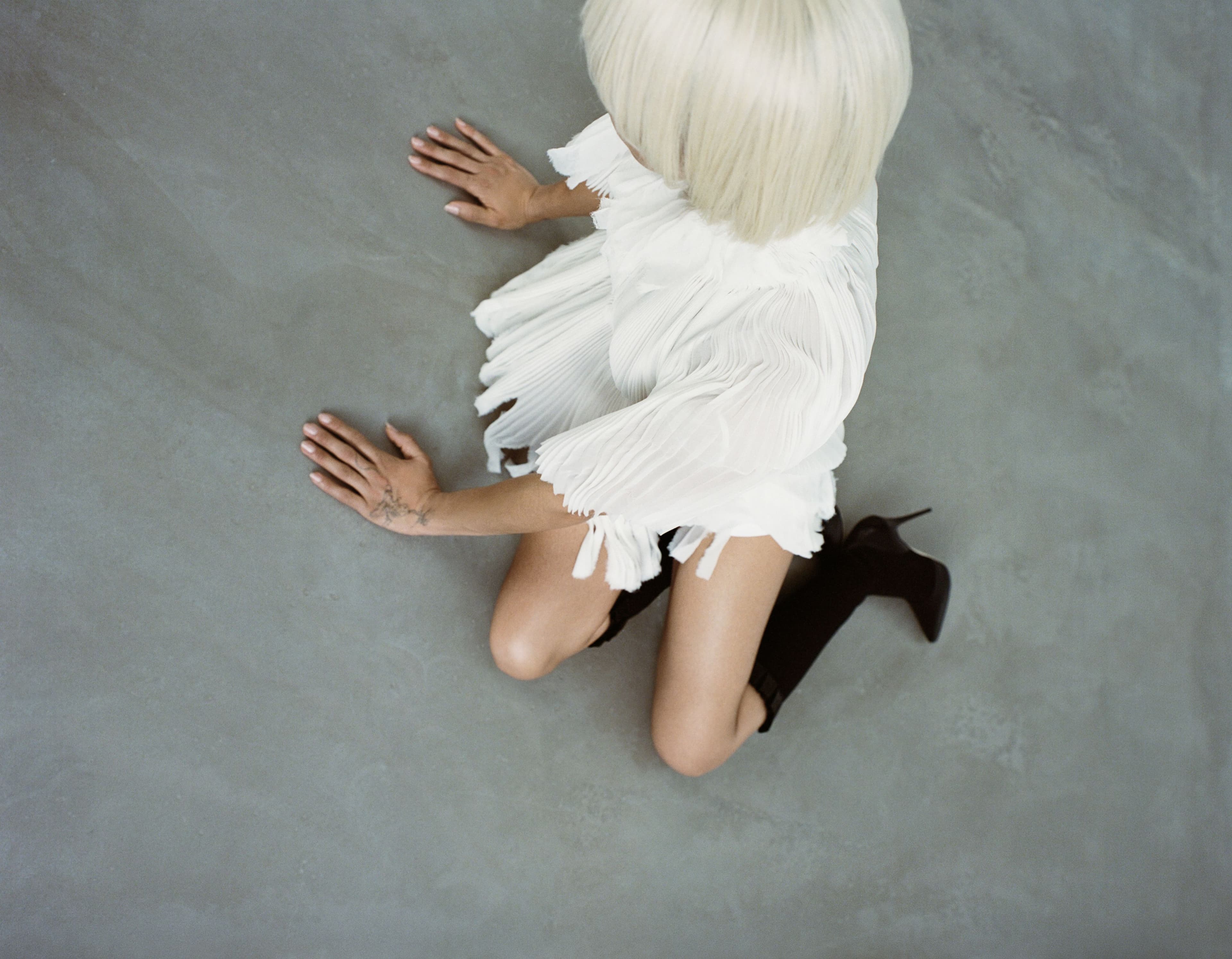 SHIRT by McQueen; SHORTS by Cou Cou Intimates; SHOES by Manolo Blahnik